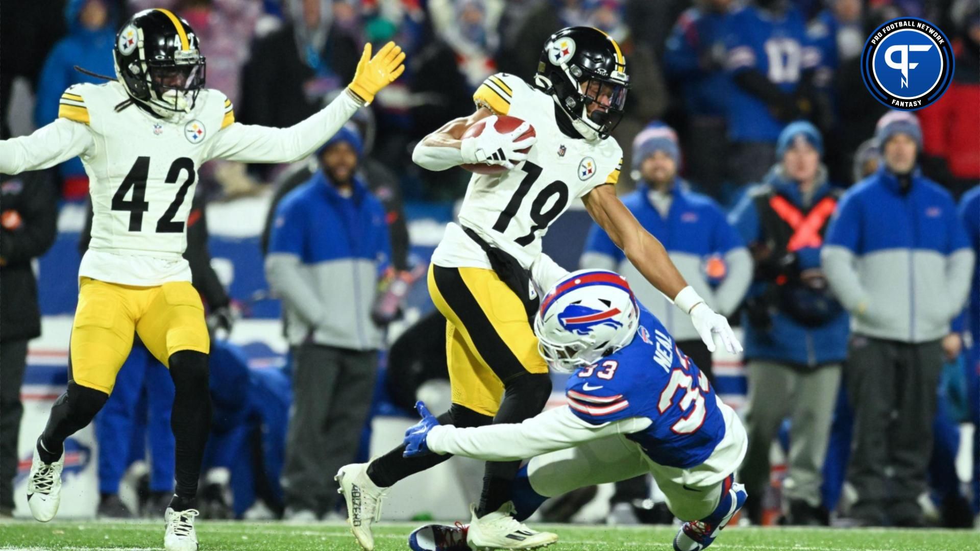 Pittsburgh Steelers wide receiver Calvin Austin III (19) is tackled by Buffalo Bills cornerback Siran Neal (33) in the second half in a 2024 AFC wild card game at Highmark Stadium.