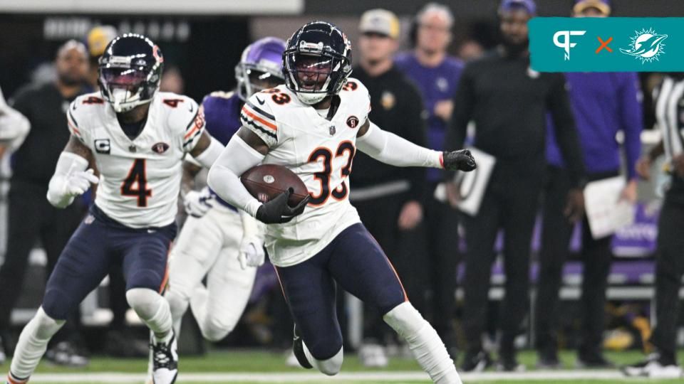 Chicago Bears cornerback Jaylon Johnson (33) returns an interception as safety Eddie Jackson (4) looks on against the Minnesota Vikings during the second quarter at U.S. Bank Stadium.