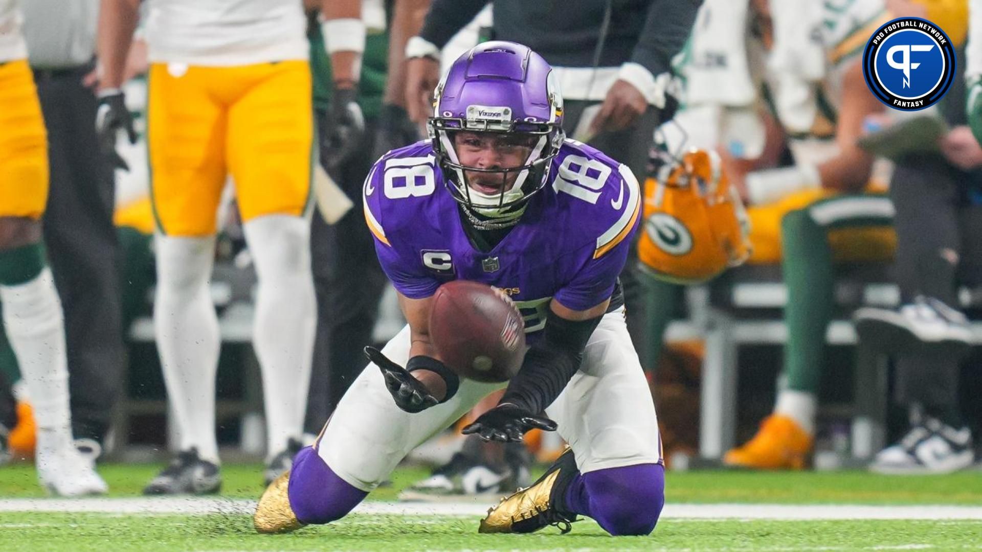 Minnesota Vikings wide receiver Justin Jefferson (18) catches a pass against the Green Bay Packers in the second quarter at U.S. Bank Stadium