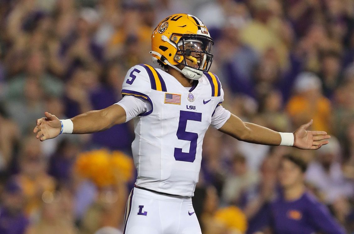 LSU Tigers quarterback Jayden Daniels (5) celebrates a touchdown against the Army Black Knights during the first half at Tiger Stadium.