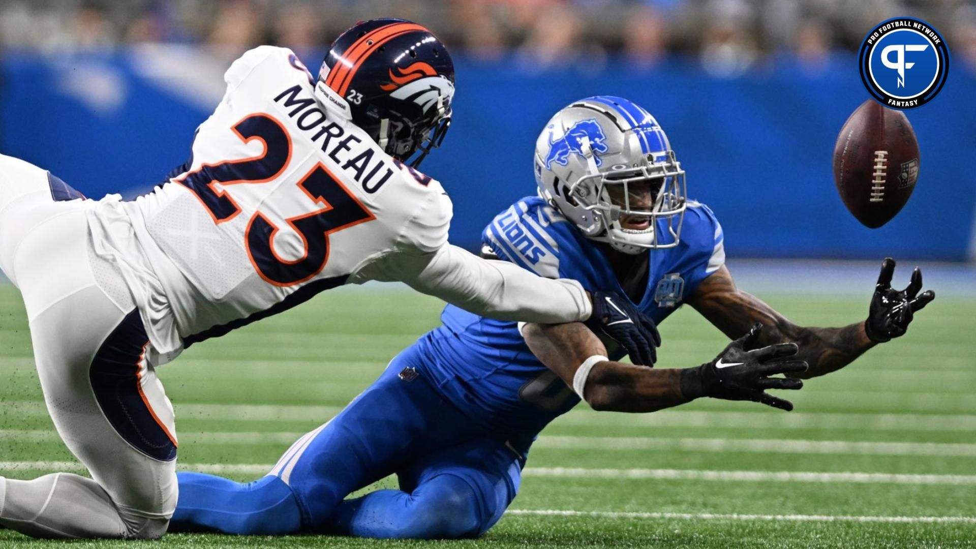 Detroit Lions wide receiver Josh Reynolds (8) tries to pull in a pass against Denver Broncos cornerback Fabian Moreau (23) in the fourth quarter at Ford Field. Moreau was flagged for pass interference on the play.