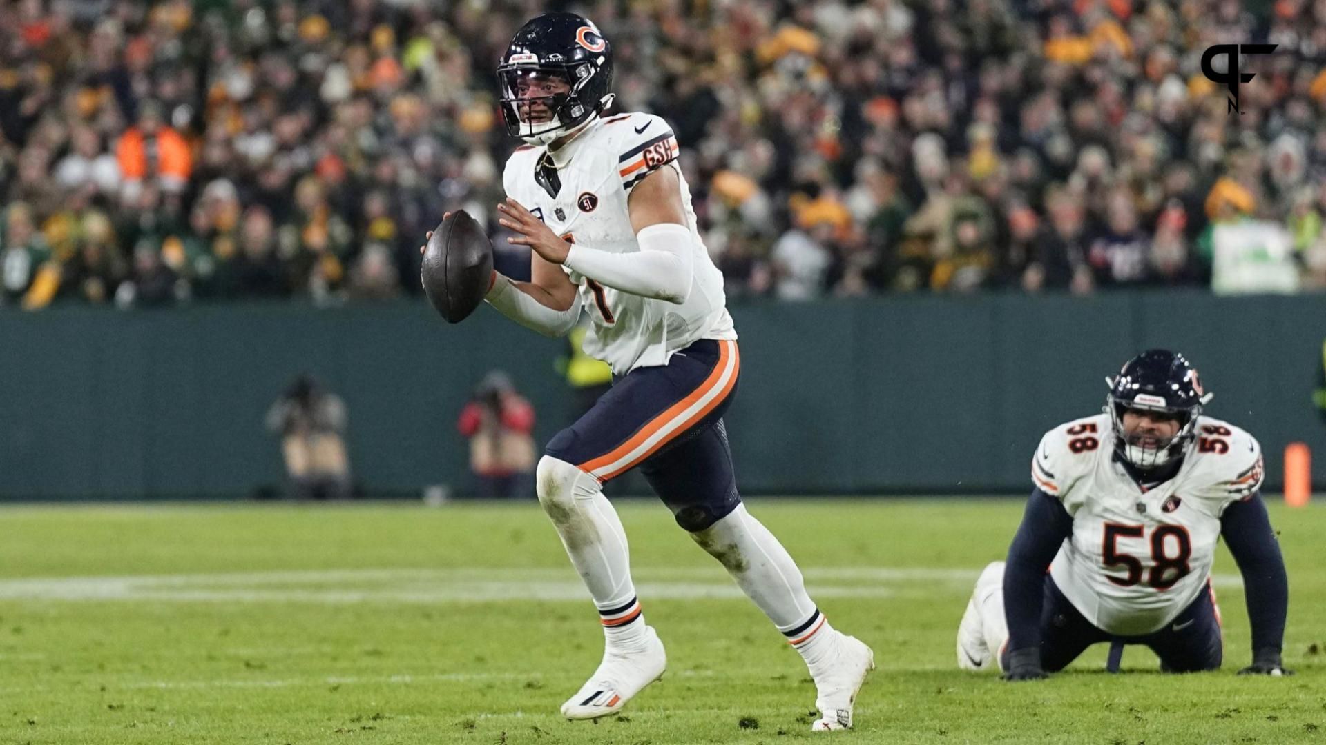 Chicago Bears quarterback Justin Fields (1) looks to throw a pass during the fourth quarter against the Green Bay Packers at Lambeau Field.