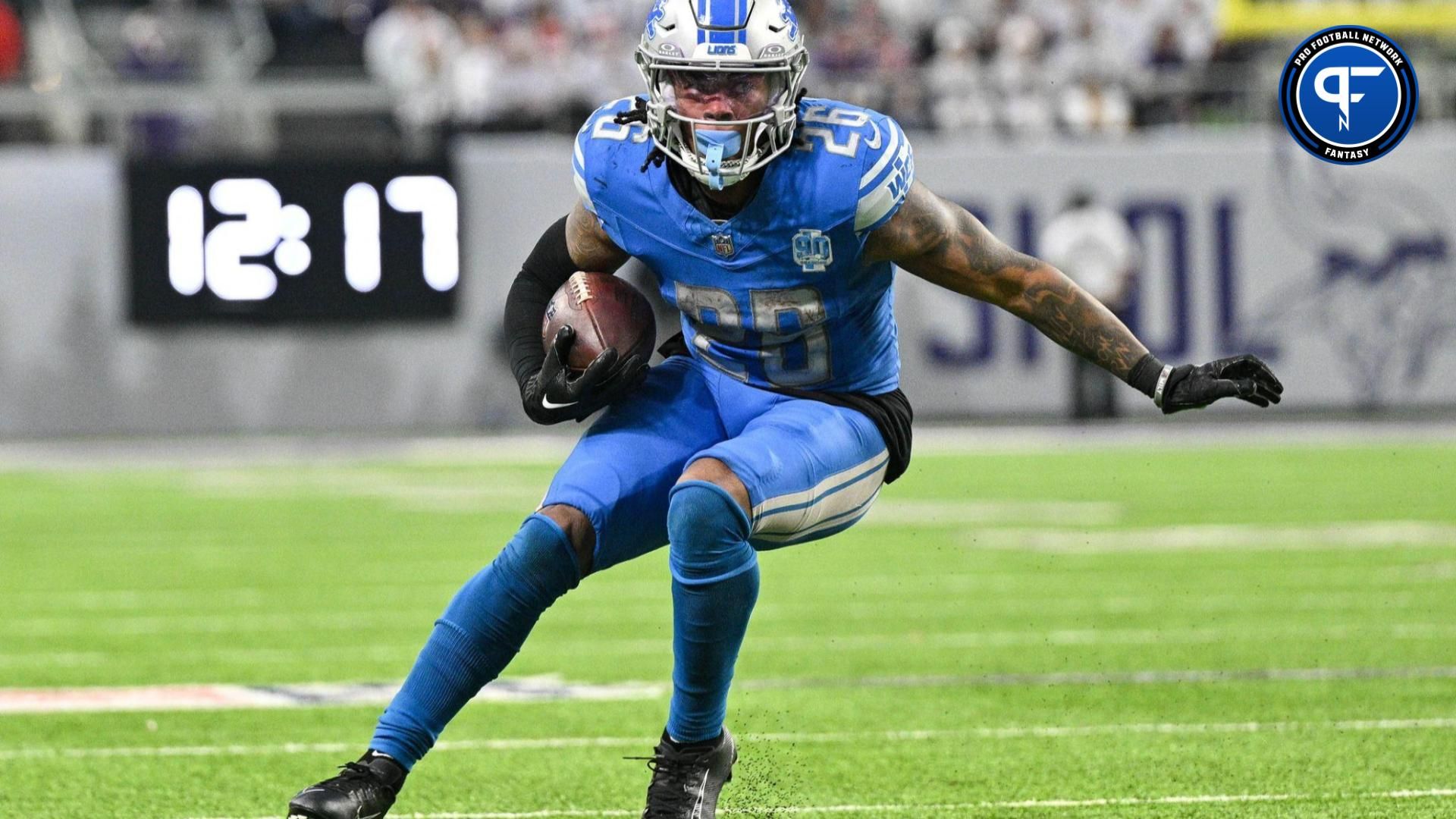 Detroit Lions running back Jahmyr Gibbs (26) runs the ball against the Minnesota Vikings at U.S. Bank Stadium.