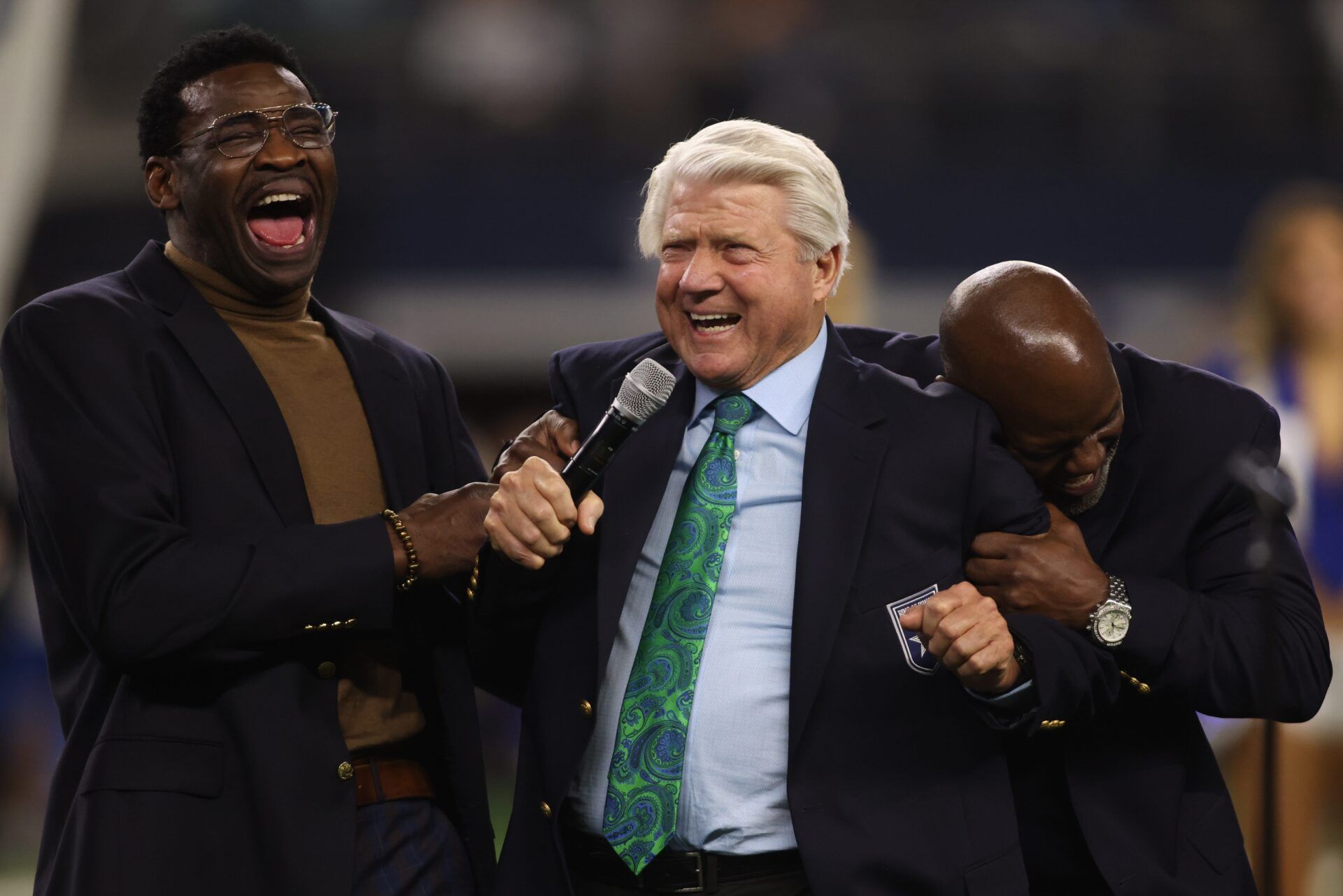 Former Dallas Cowboys Michael Irvin, Jimmy Johnson and Emmitt Smith react during the Ring of Honor ceremony at the half time of the game against the Detroit Lions at AT&T Stadium.