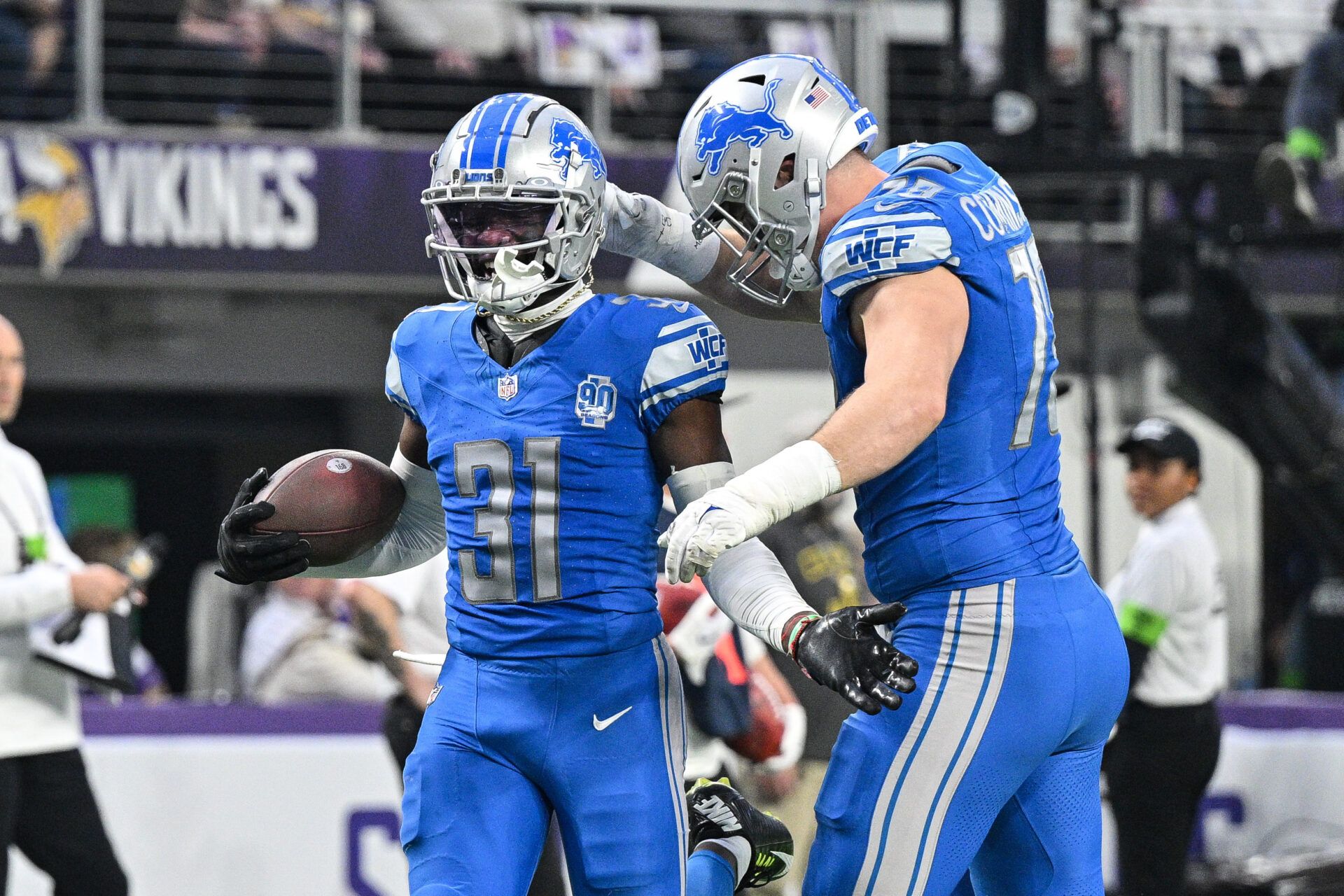 Detroit Lions safety Kerby Joseph (31) and defensive end John Cominsky (79) react during the game against the Minnesota Vikings at U.S. Bank Stadium.