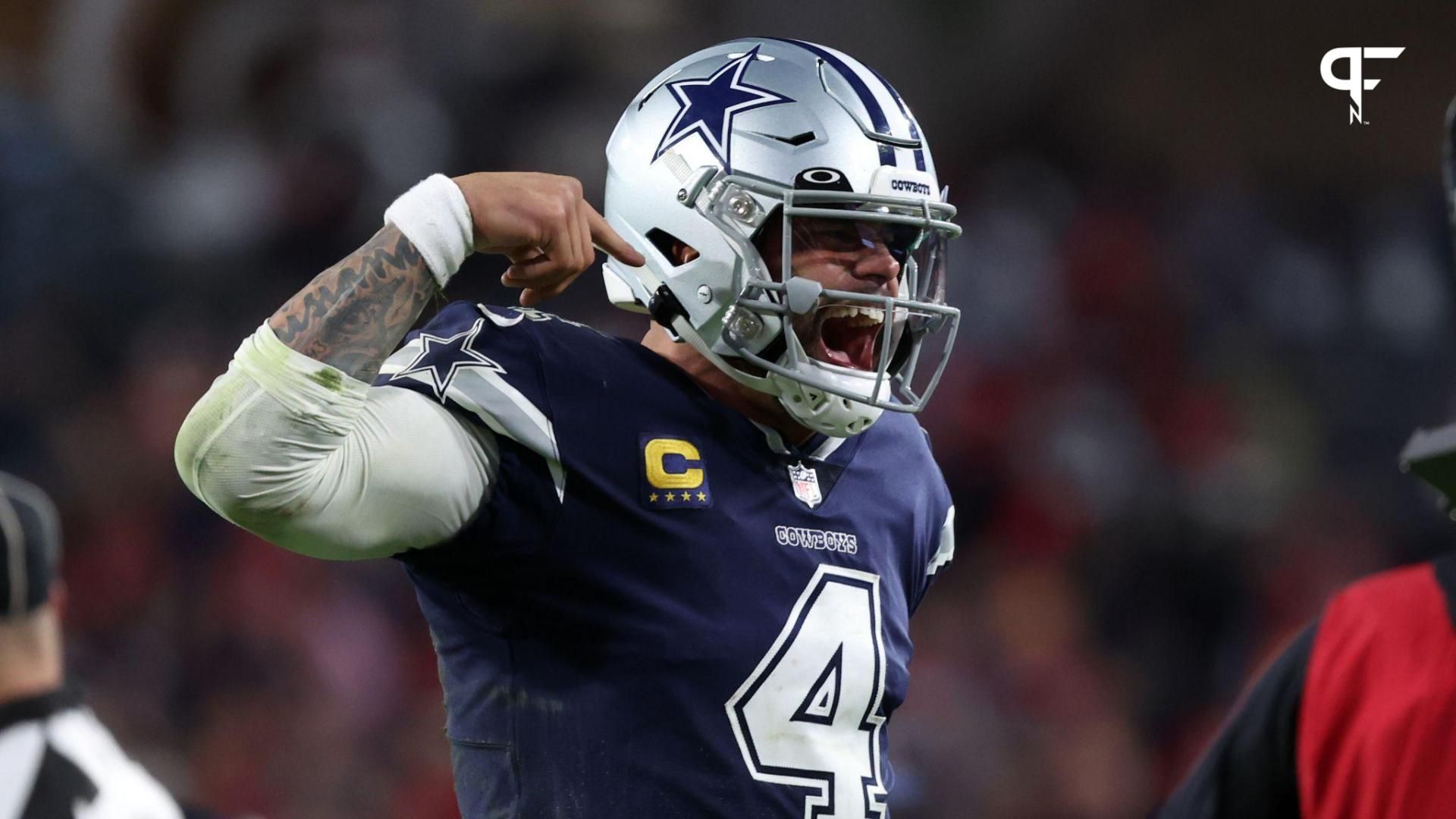 Dallas Cowboys quarterback Dak Prescott (4) reacts after throwing a touchdown pass against the Tampa Bay Buccaneers in the second half during the wild card game at Raymond James Stadium.