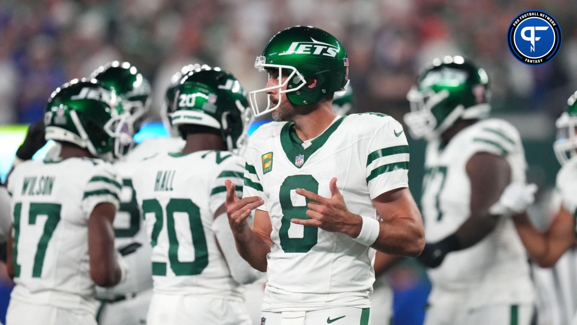 New York Jets quarterback Aaron Rodgers (8) walks onto the field with the offense to face the Buffalo Bills in the home opener at MetLife Stadium on Monday, Sept. 11, 2023, in East Rutherford.