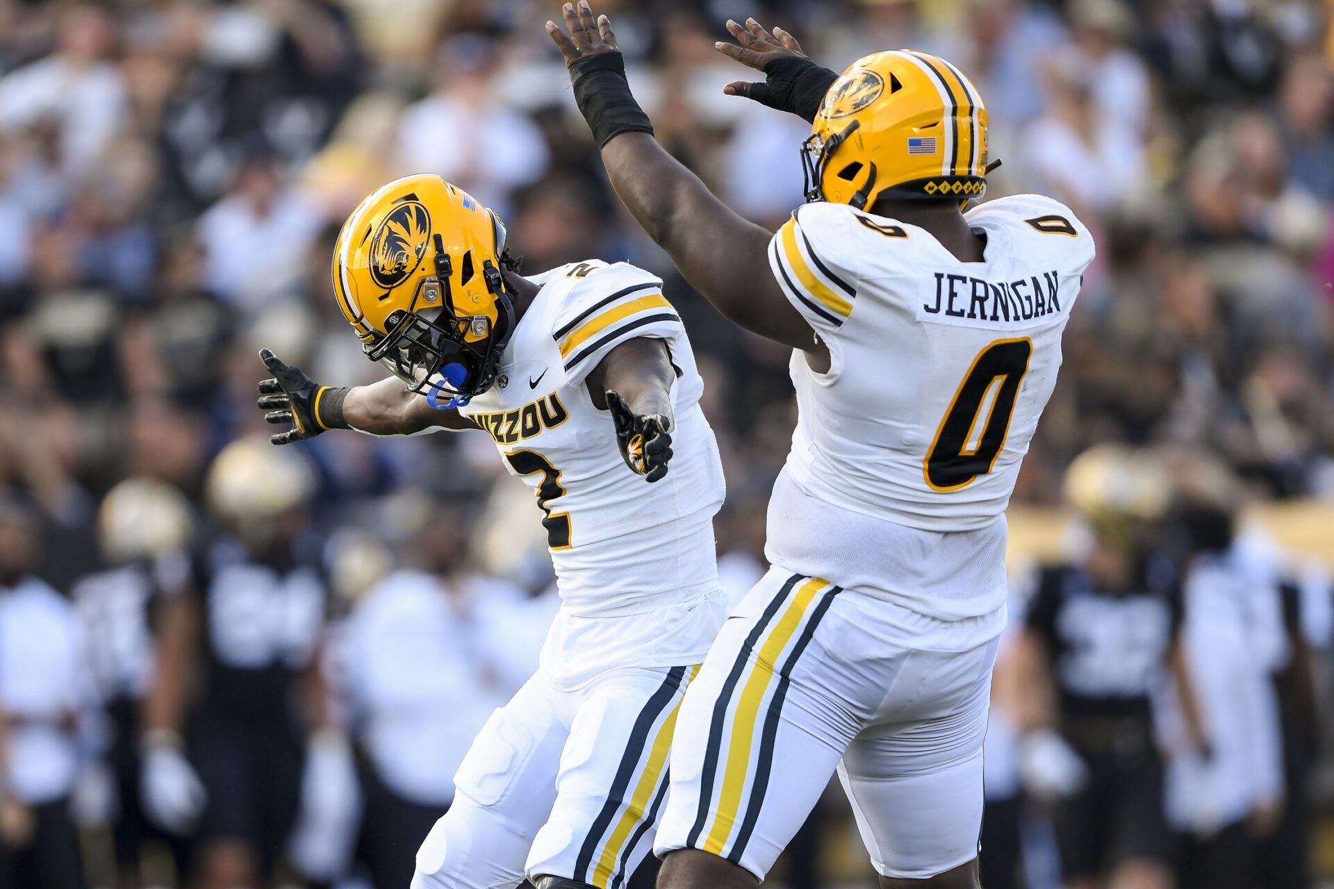 Missouri Tigers safety Ennis Rakestraw Jr. (2) and defensive lineman Jayden Jernigan (0) celebrate Rakestraw Jr.’s tackle for a loss of Vanderbilt Commodores tight end Justin Ball (84) during the first half at FirstBank Stadium.