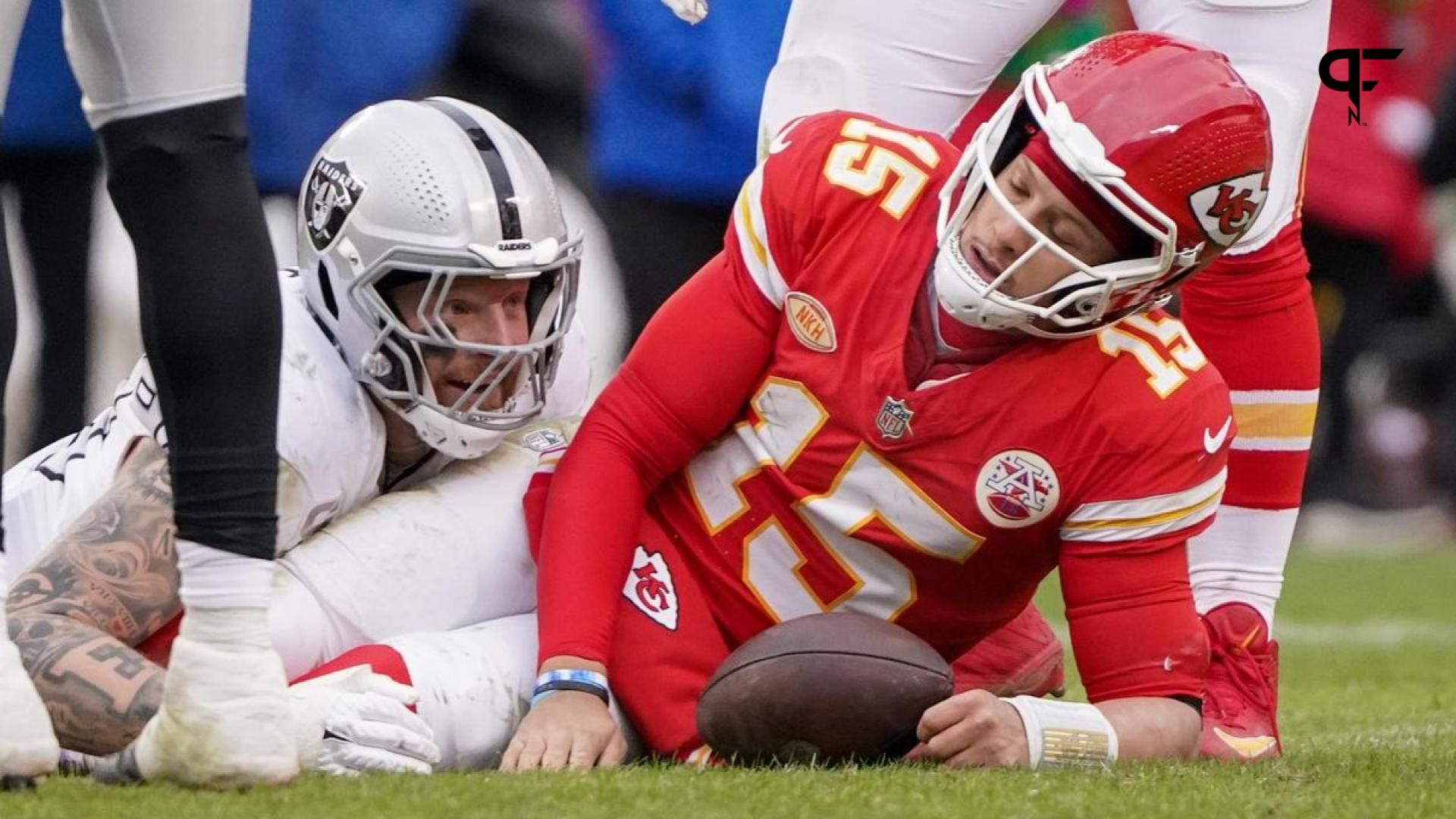 Kansas City Chiefs QB Patrick Mahomes (15) reacts after being sacked by Las Vegas Raiders DE Maxx Crosby (98).