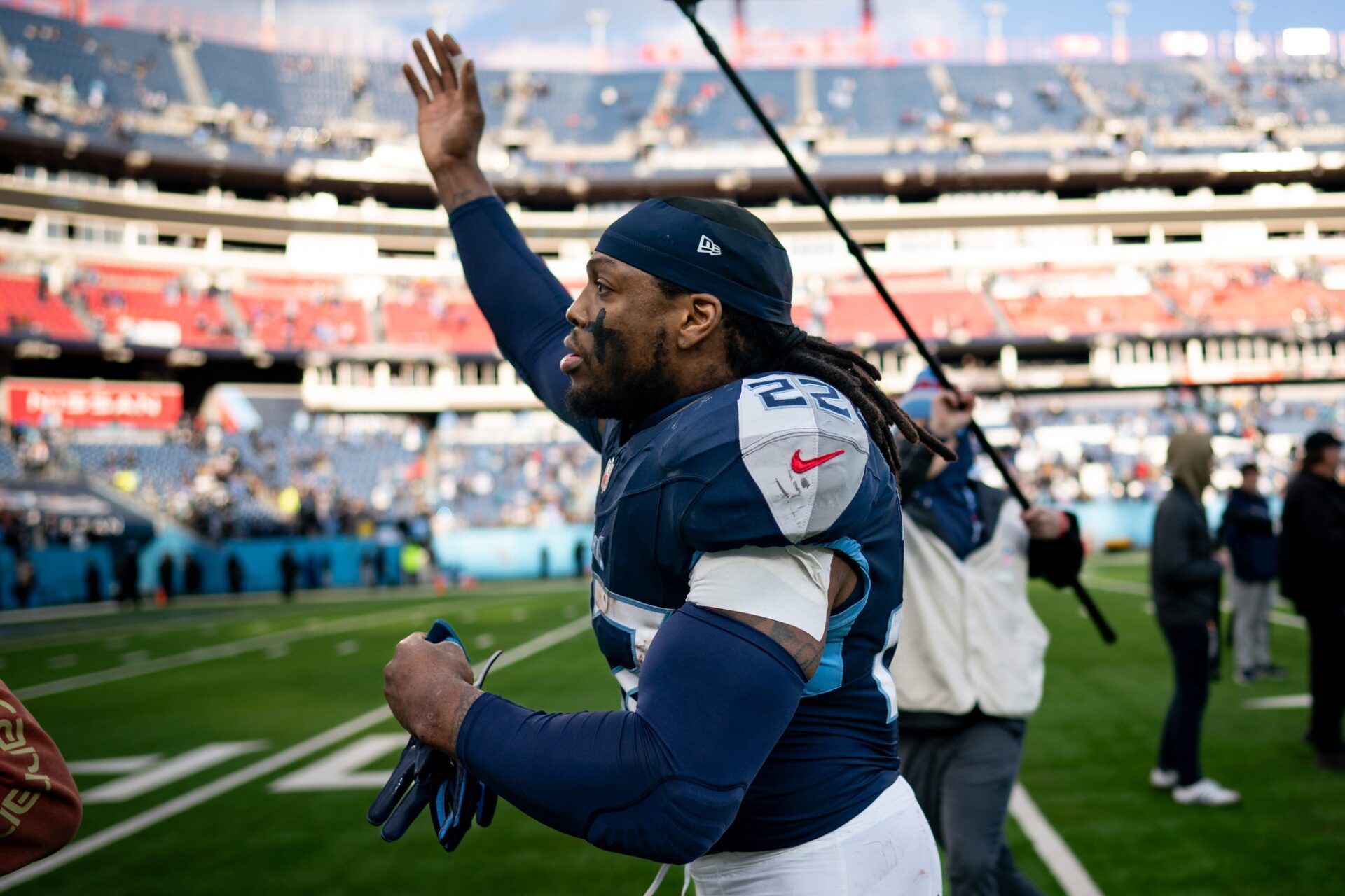 Derrick Henry (22) waves to fans as he exits the field after defeating Jacksonville Jaguars 28-20 at Nissan Stadium.