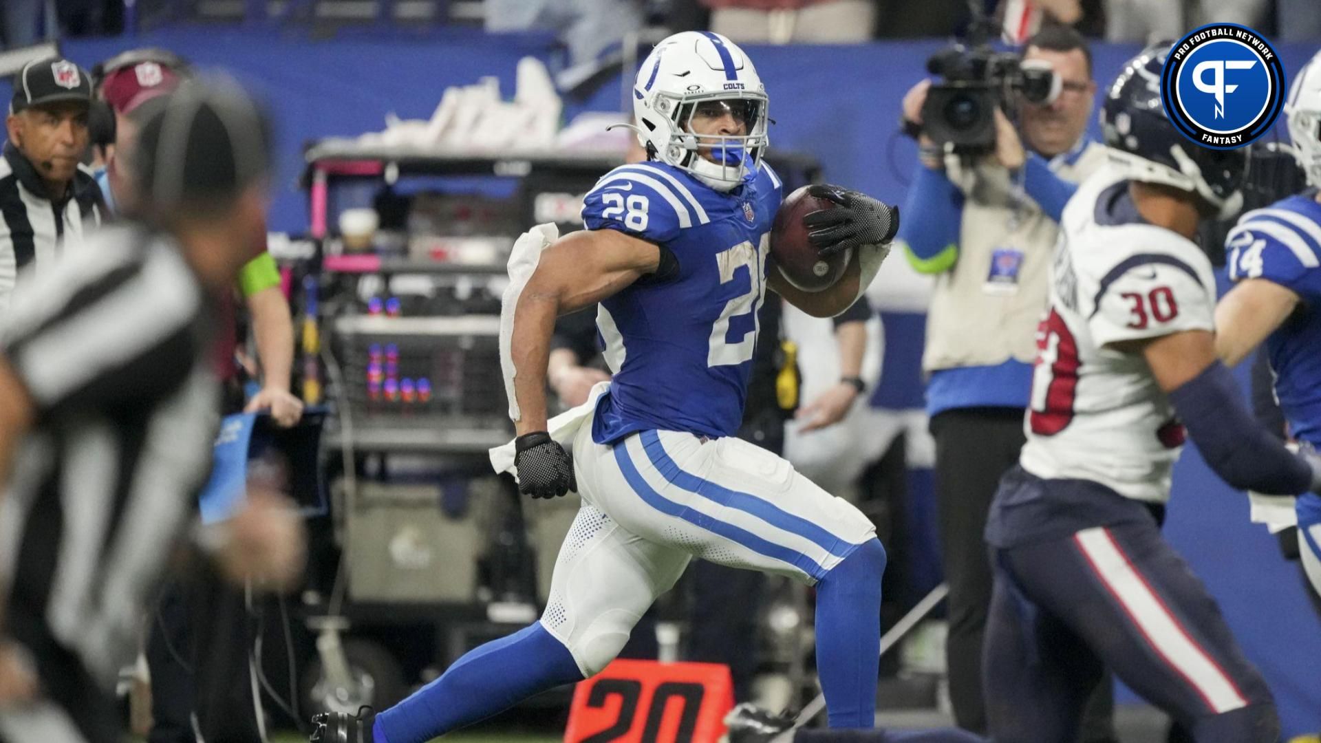 Indianapolis Colts running back Jonathan Taylor (28) rushes along the sideline against the Houston Texans at Lucas Oil Stadium.