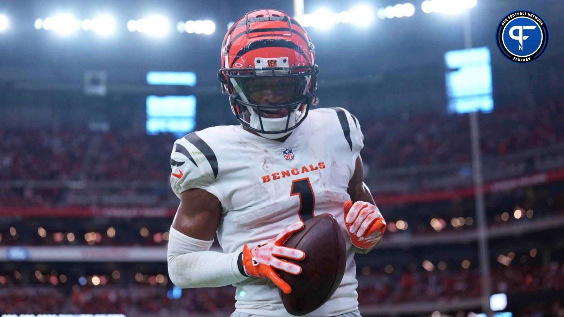 Cincinnati Bengals wide receiver Ja'Marr Chase (1) celebrates a touchdown catch against the Arizona Cardinals during the second half at State Farm Stadium.