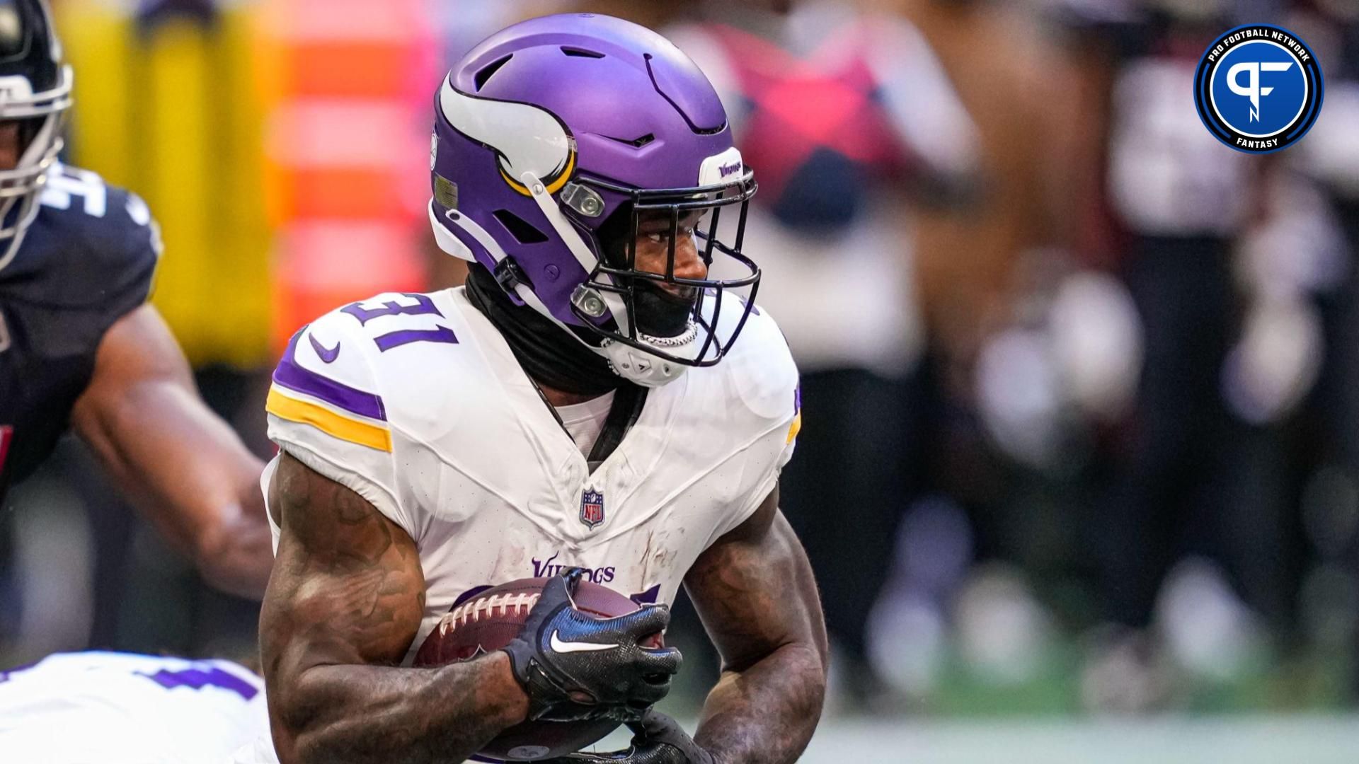 Minnesota Vikings running back Cam Akers (31) runs with the ball against the Atlanta Falcons at Mercedes-Benz Stadium.