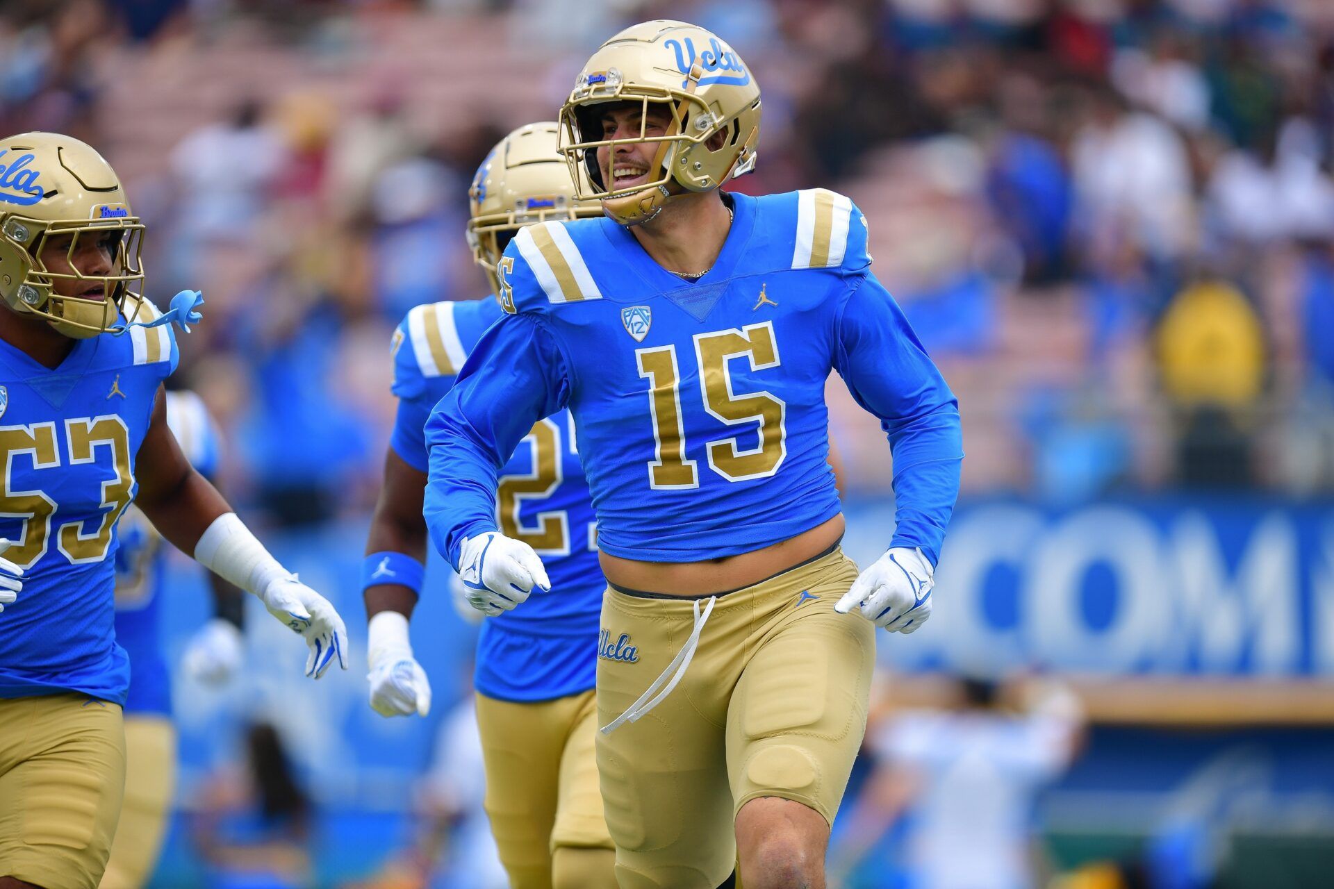 UCLA Bruins defensive lineman Laiatu Latu (15) celebrates after intercepting a pass against the North Carolina Central Eagles during the first half at Rose Bowl.