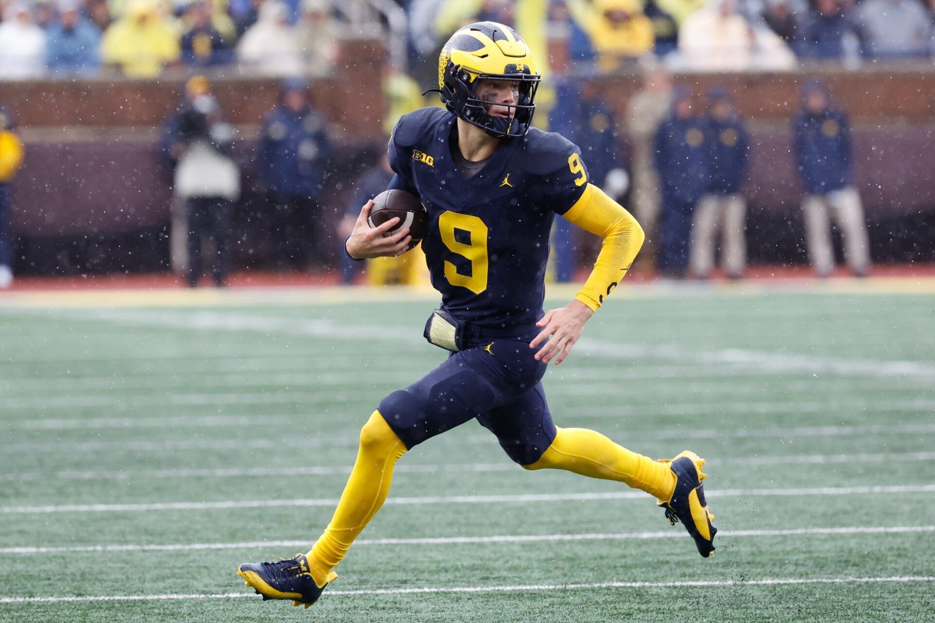 Michigan Wolverines quarterback J.J. McCarthy (9) rushes in the second half against the Indiana Hoosiers at Michigan Stadium.