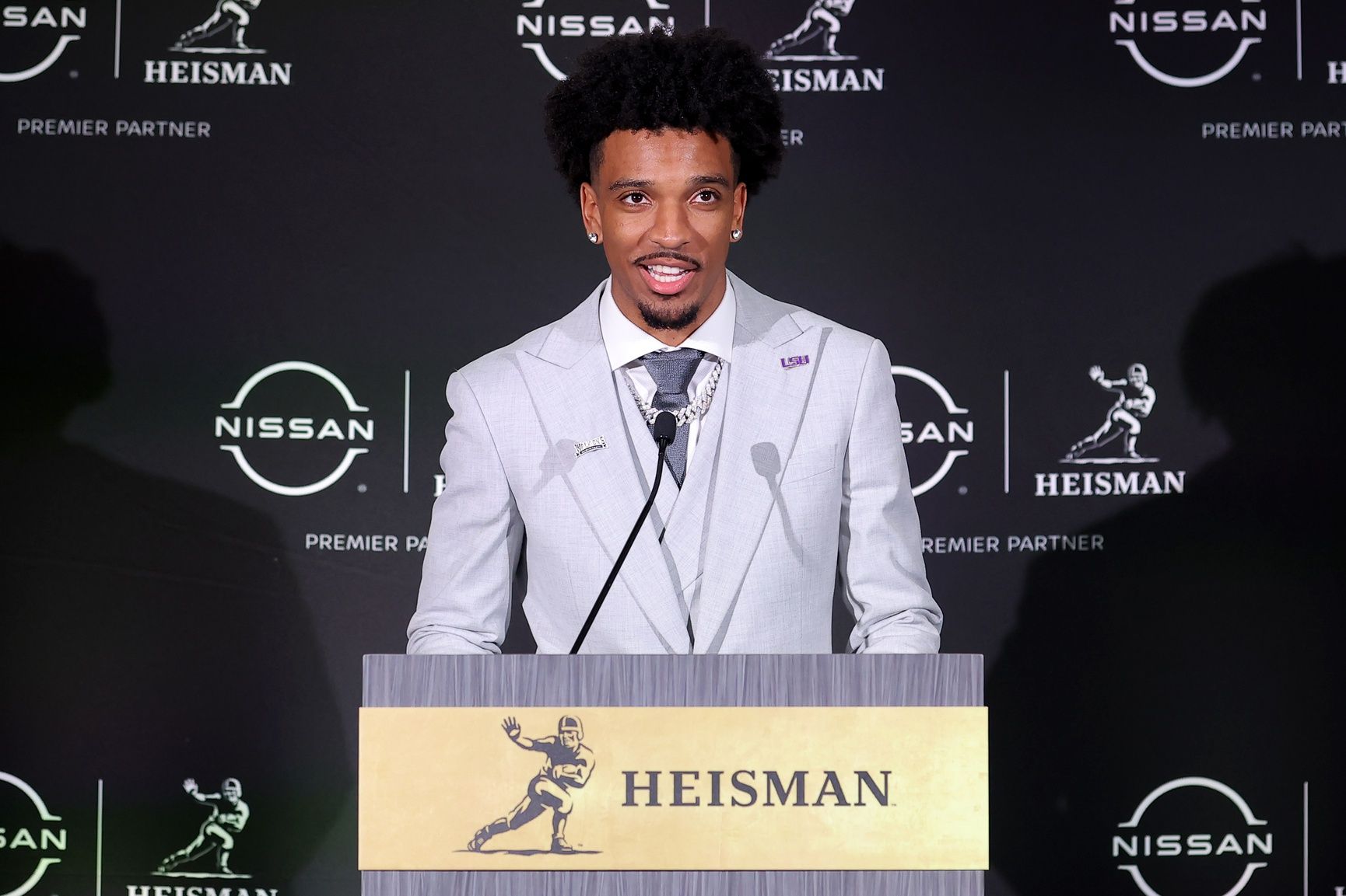 LSU Tigers quarterback Jayden Daniels speaks to the media during a press conference in the Astor ballroom at the New York Marriott Marquis after winning the Heisman trophy.