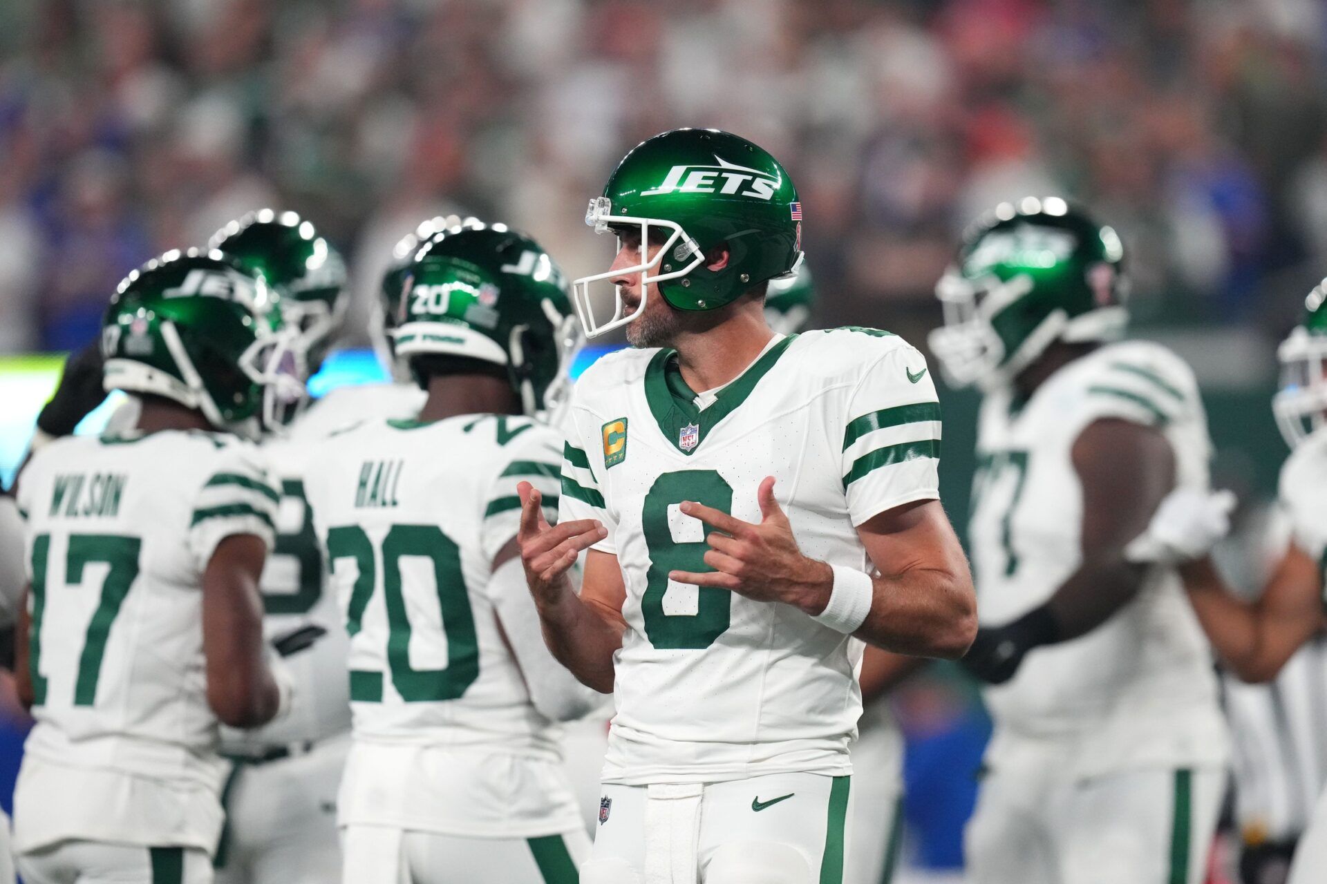 New York Jets quarterback Aaron Rodgers (8) walks onto the field with the offense to face the Buffalo Bills in the home opener at MetLife Stadium.