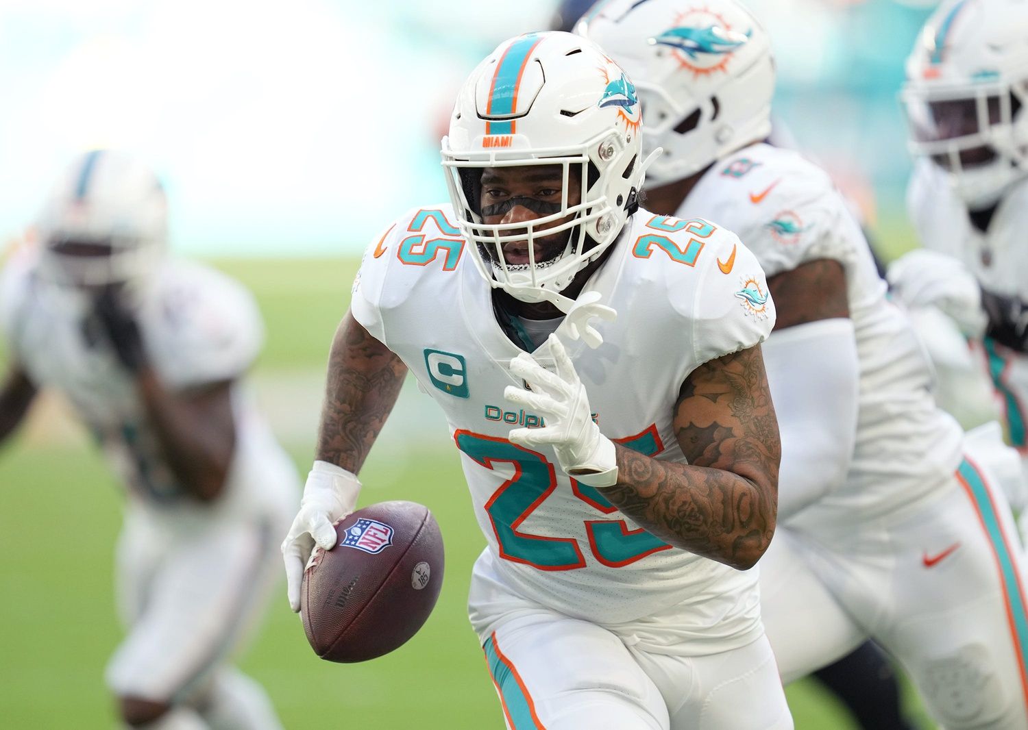 Xavien Howard (25) returns a fumble for a touchdown against the Houston Texans during the first half of an NFL game at Hard Rock Stadium.