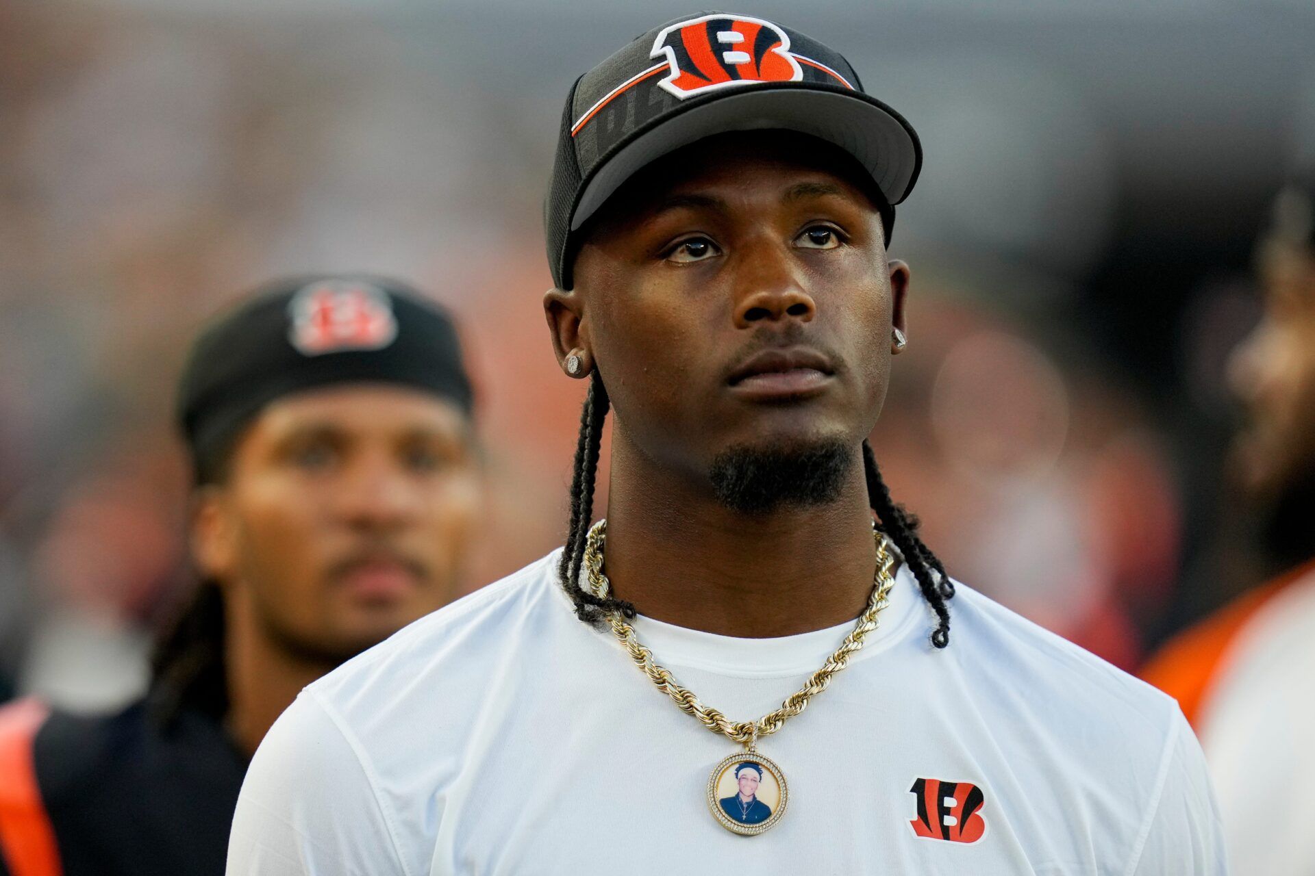 Cincinnati Bengals wide receiver Tee Higgins (5) watches the video board on the sideline in the second quarter of the NFL Preseason Week 1 game between the Cincinnati Bengals and the Green Bay Packers at Paycor Stadium in downtown Cincinnati on Friday, Aug. 11, 2023. The Packers led 21-16 at halftime.