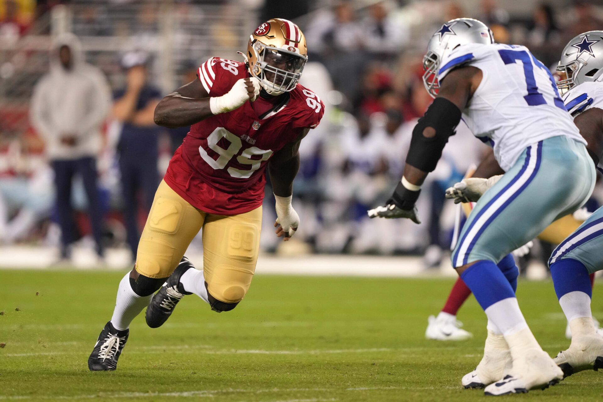 San Francisco 49ers defensive tackle Javon Kinlaw (99) rushes against Dallas Cowboys offensive tackle Tyron Smith (left) during the fourth quarter at Levi's Stadium.