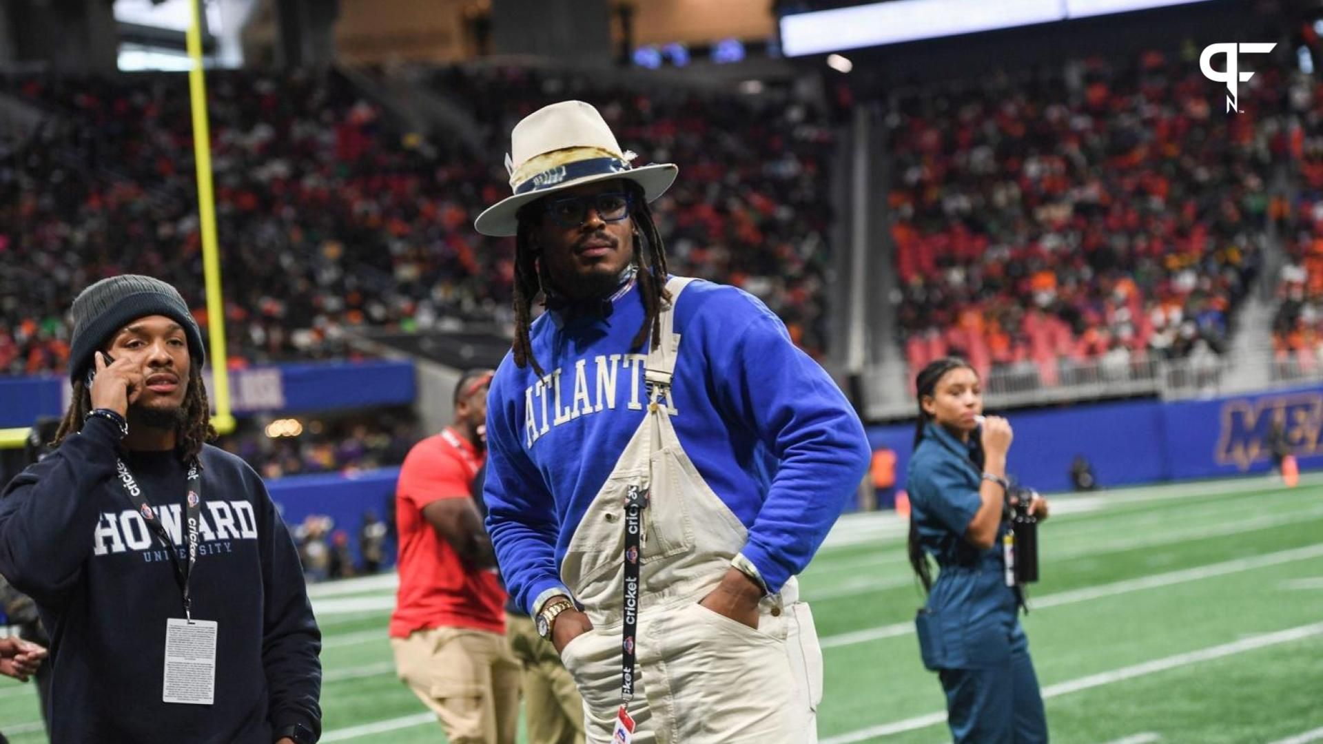 Former Auburn and NFL star Cam Newton stands on the sidelines during the Cricket Celebration Bowl game between Florida A&M University and Howard University at Mercedes-Benz Stadium