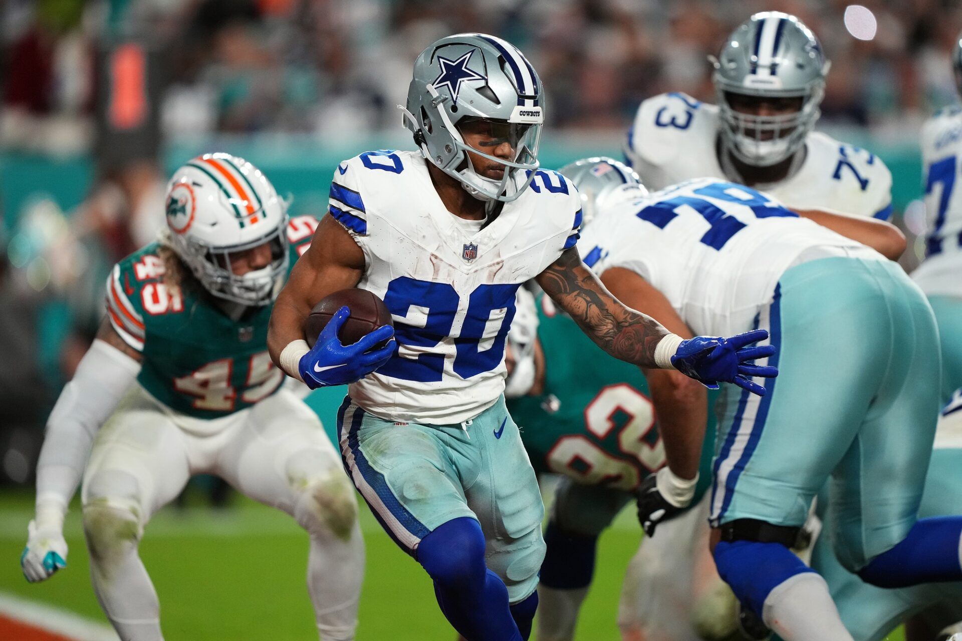 Dallas Cowboys running back Tony Pollard (20) runs the ball against the Miami Dolphins during the second half at Hard Rock Stadium.