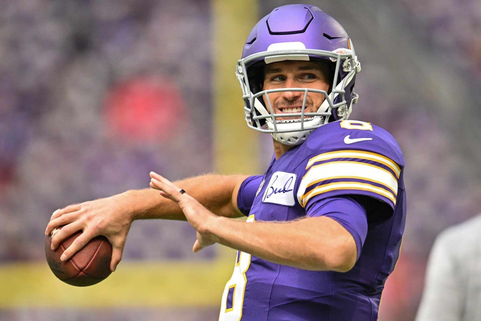 Minnesota Vikings quarterback Kirk Cousins (8) warms up before the game against the Tampa Bay Buccaneers at U.S. Bank Stadium.