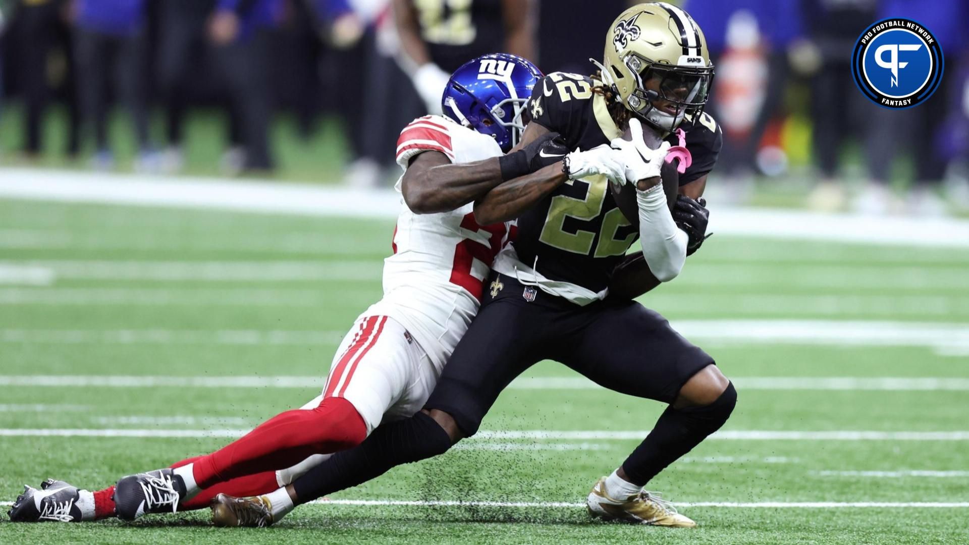 New Orleans Saints wide receiver Rashid Shaheed (22) is tackled during the second half against the New York Giants at Caesars Superdome.