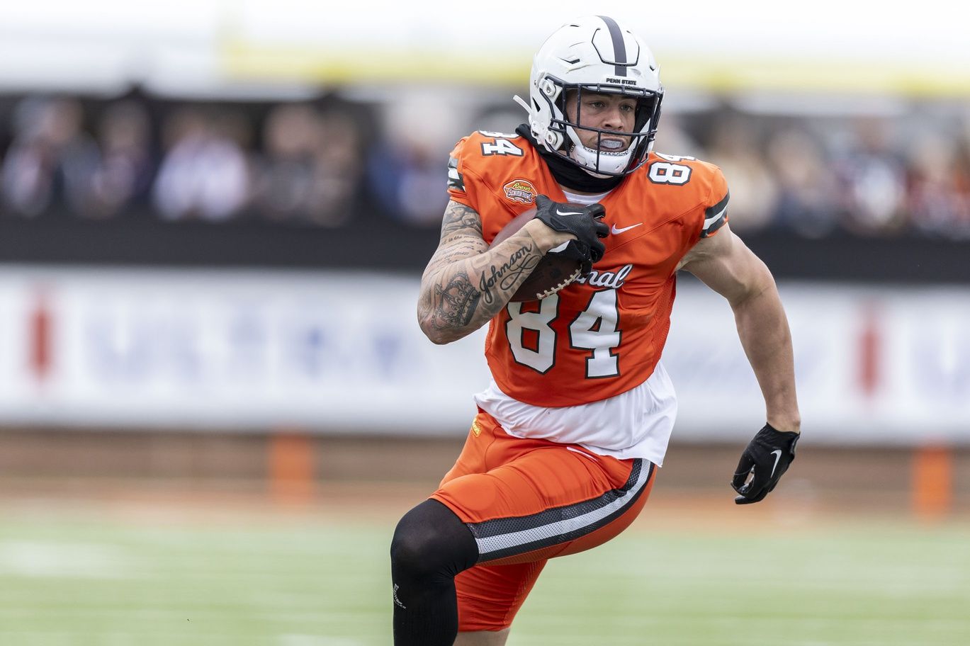 National tight end Theo Johnson of Penn State (84) runs after a catch during the first half of the 2024 Senior Bowl football game at Hancock Whitney Stadium.