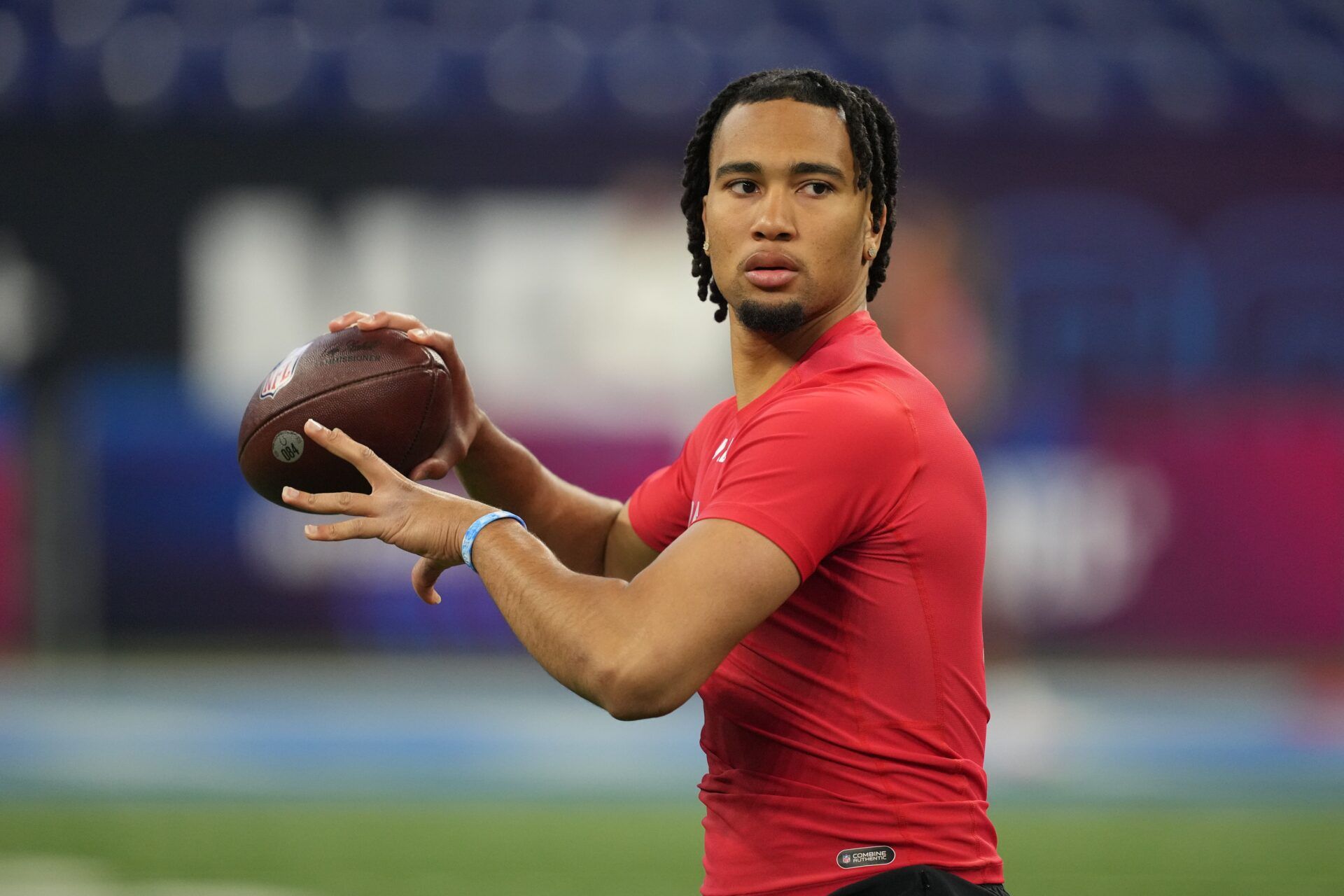 Ohio State quarterback C J Stroud (QB12) participates in drills at Lucas Oil Stadium.