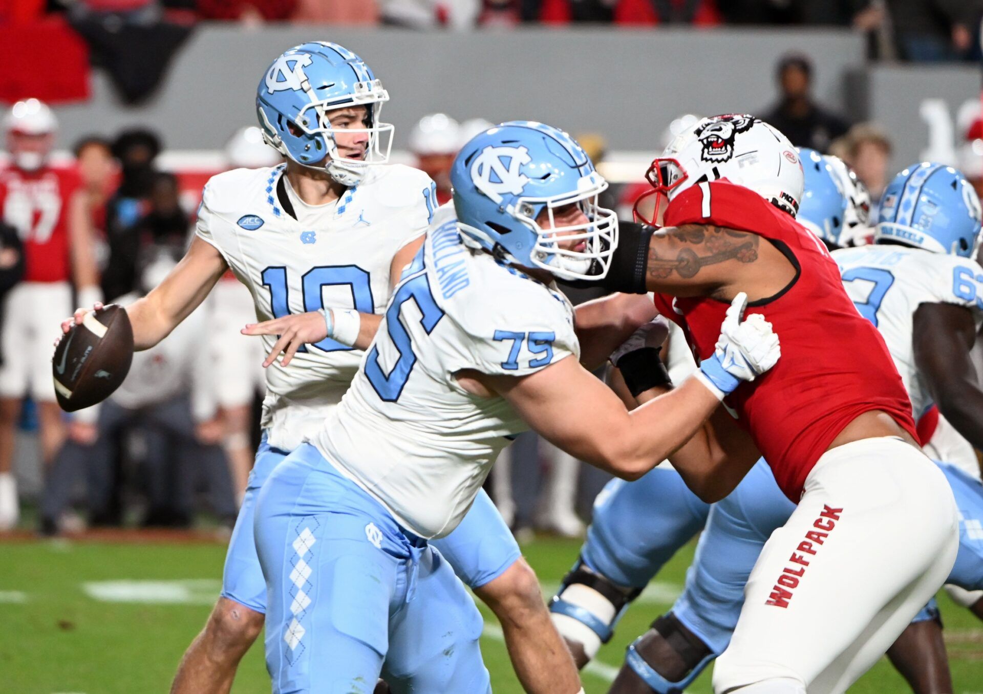 North Carolina Tar Heels quarterback Drake Maye (10) drops back to pass against the North Carolina State Wolfpack during the first half at Carter-Finley Stadium.