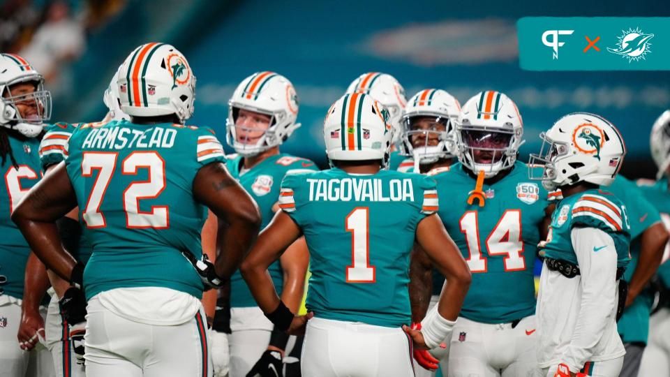 Miami Dolphins offensive tackle Terron Armstead (72) and Miami Dolphins quarterback Tua Tagovailoa (1) talk to teammates prior to a game against the Pittsburgh Steelers at Hard Rock Stadium.