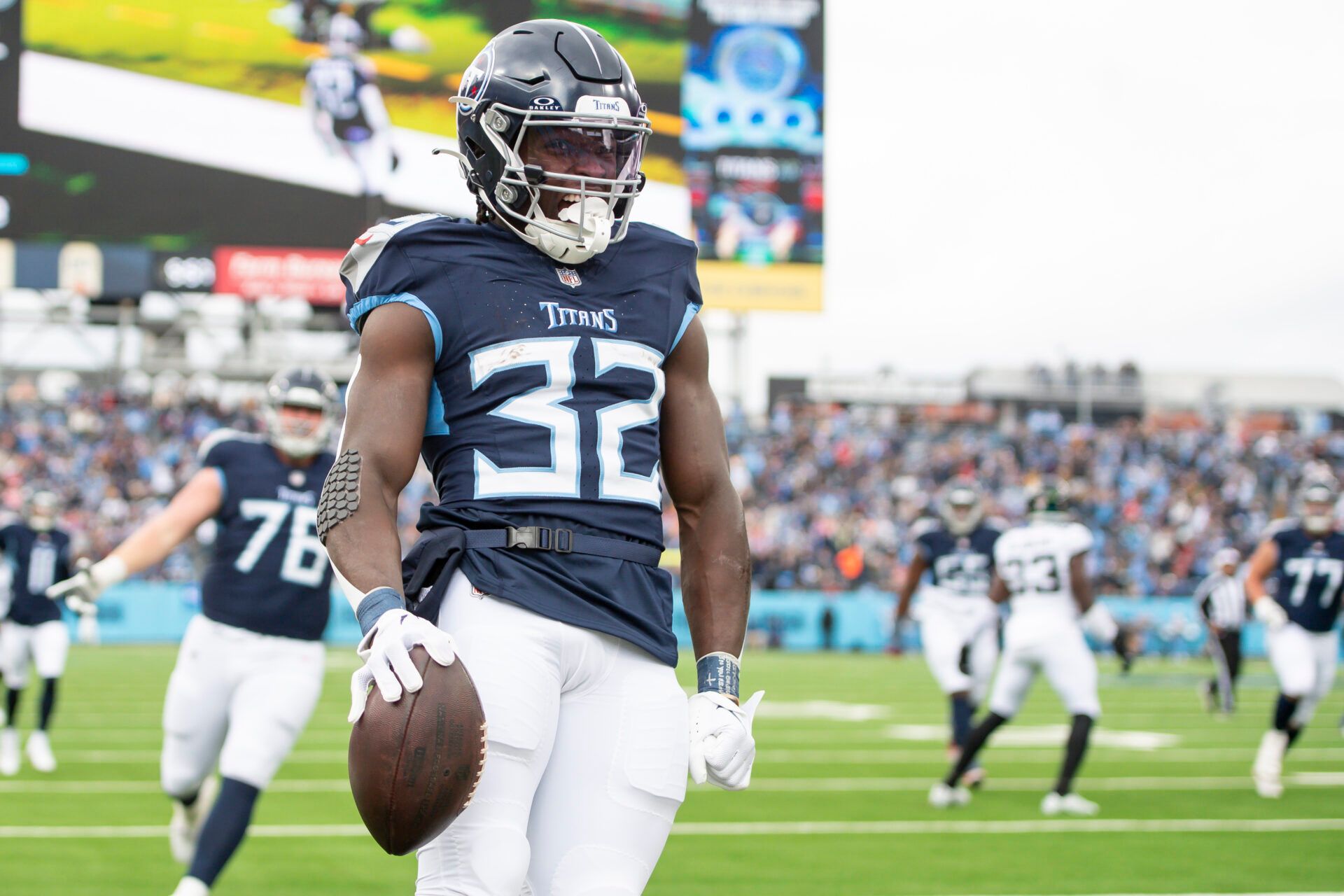 Tennessee Titans running back Tyjae Spears (32) celebrates his touchdown against the Jacksonville Jaguars during the first half at Nissan Stadium.