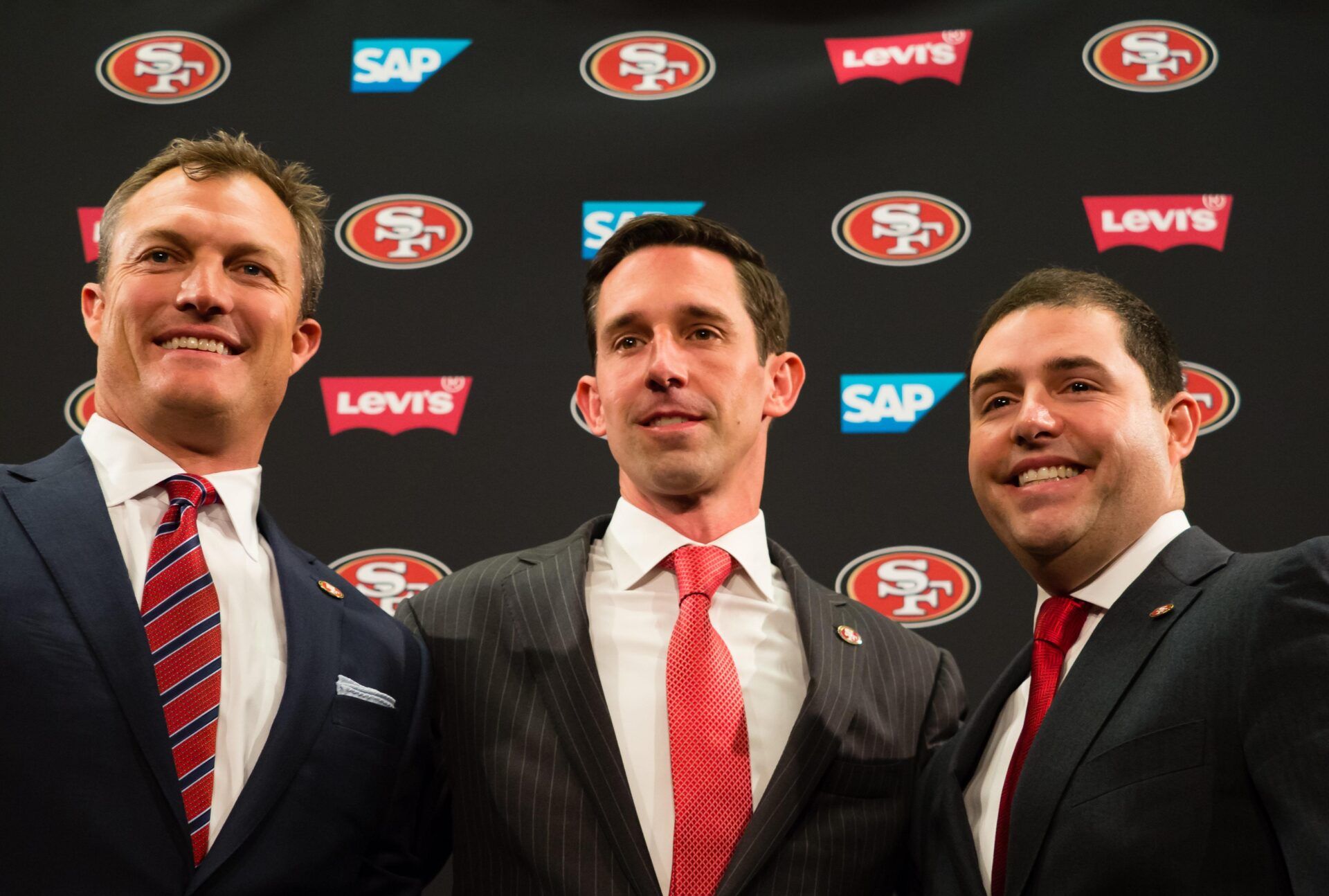 San Francisco 49ers general manager John Lynch, head coach Kyle Shanahan and chief executive officer Jed York pose for a photo during a press conference at Levi's Stadium.