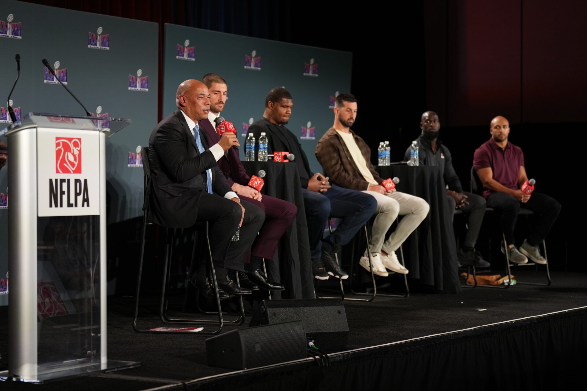 From left Lloyd Howell, JC Tretter, Calais Campbell, Brandon McManus, Michael Thomas and Austin Eckeler attend the NFLPA Press Conference at the Mandalay Bay Convention Center prior to Super Bowl LVIII.