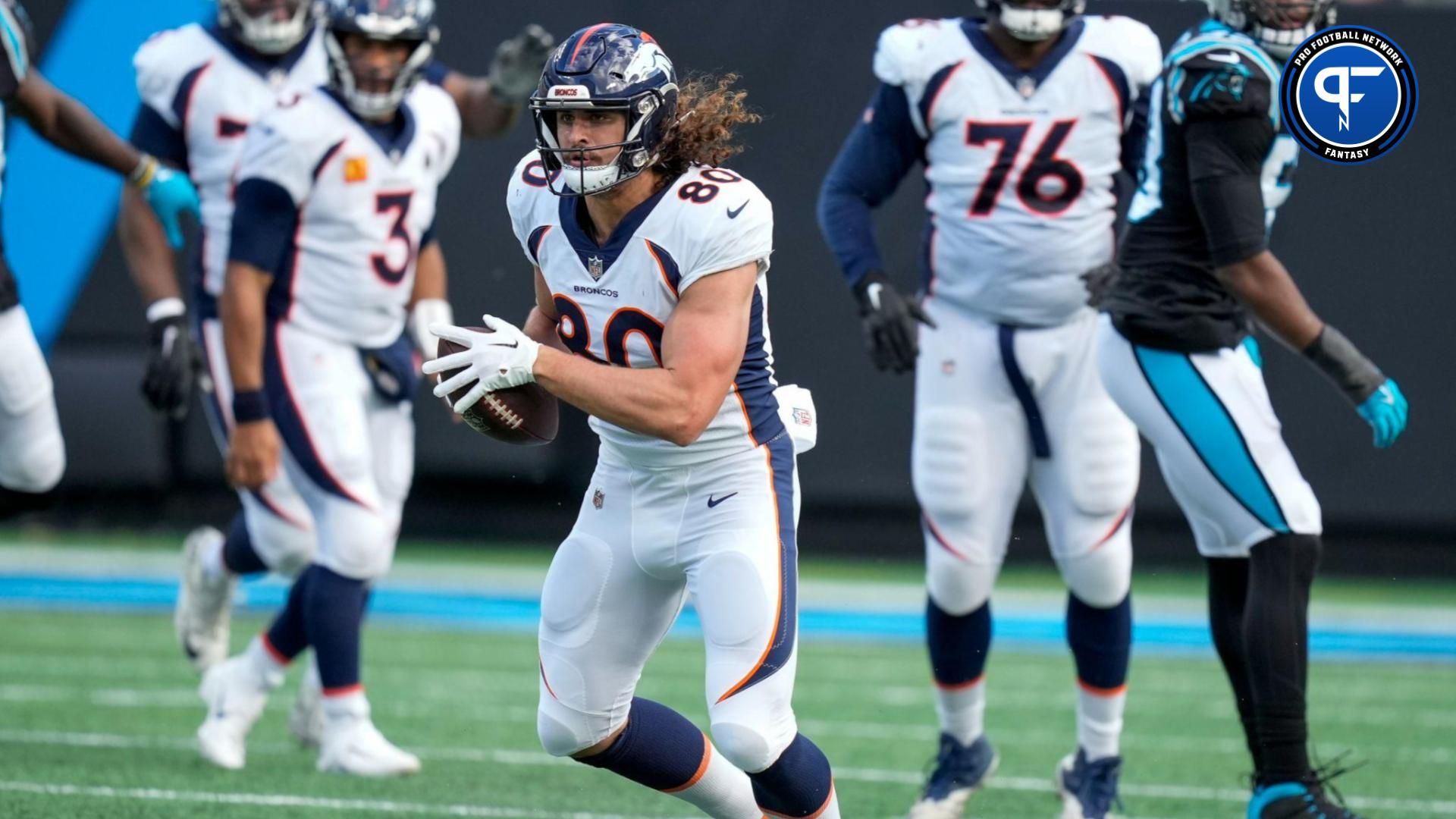 Denver Broncos tight end Greg Dulcich (80) runs for yards after catch against the Carolina Panthers during the second quarter at Bank of America Stadium.