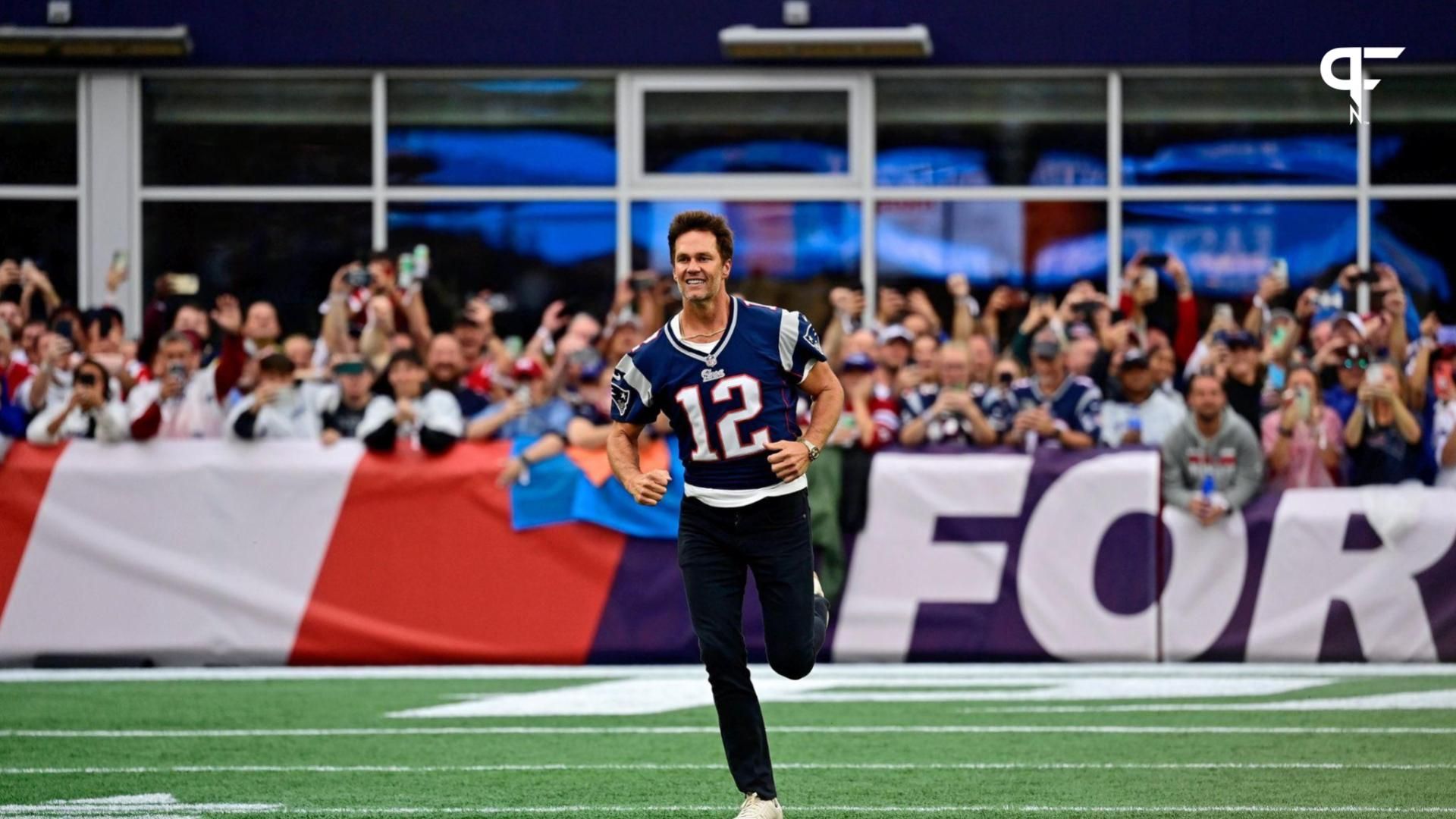 New England Patriots former quarterback Tom Brady runs on the field during a halftime ceremony in his honor during the game between the Philadelphia Eagles and New England Patriots at Gillette Stadium...