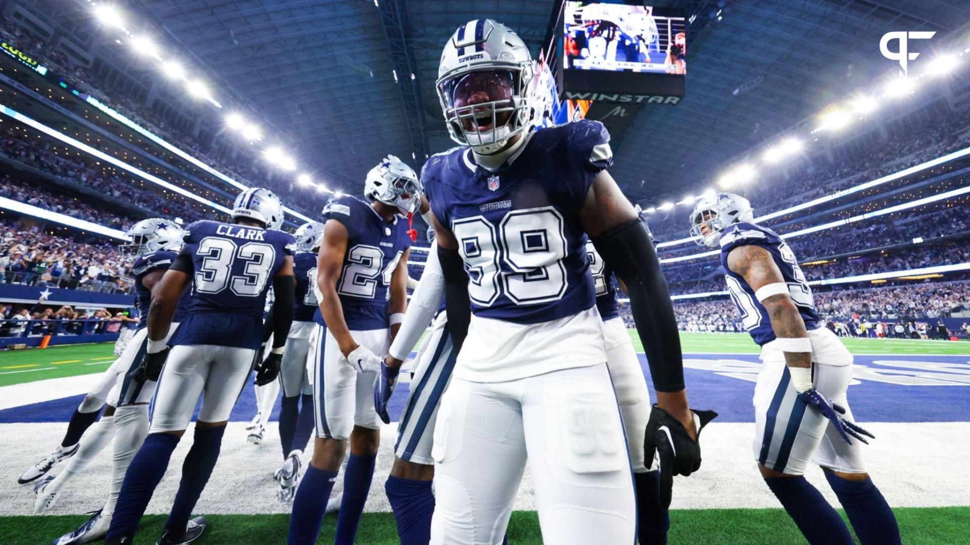 Dallas Cowboys defensive end Chauncey Golston (99) celebrates after an interception during the second half against the Detroit Lions at AT&T Stadium.