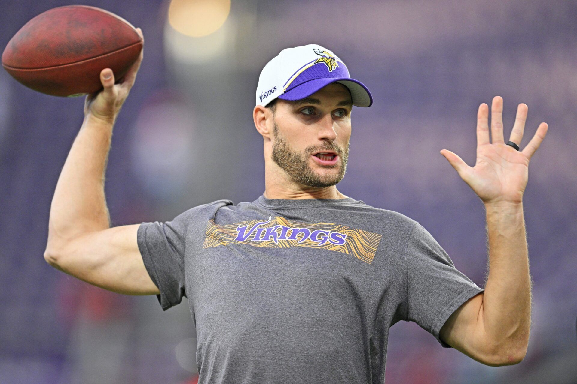 Minnesota Vikings quarterback Kirk Cousins (8) warms up before the game against the San Francisco 49ers at U.S. Bank Stadium.