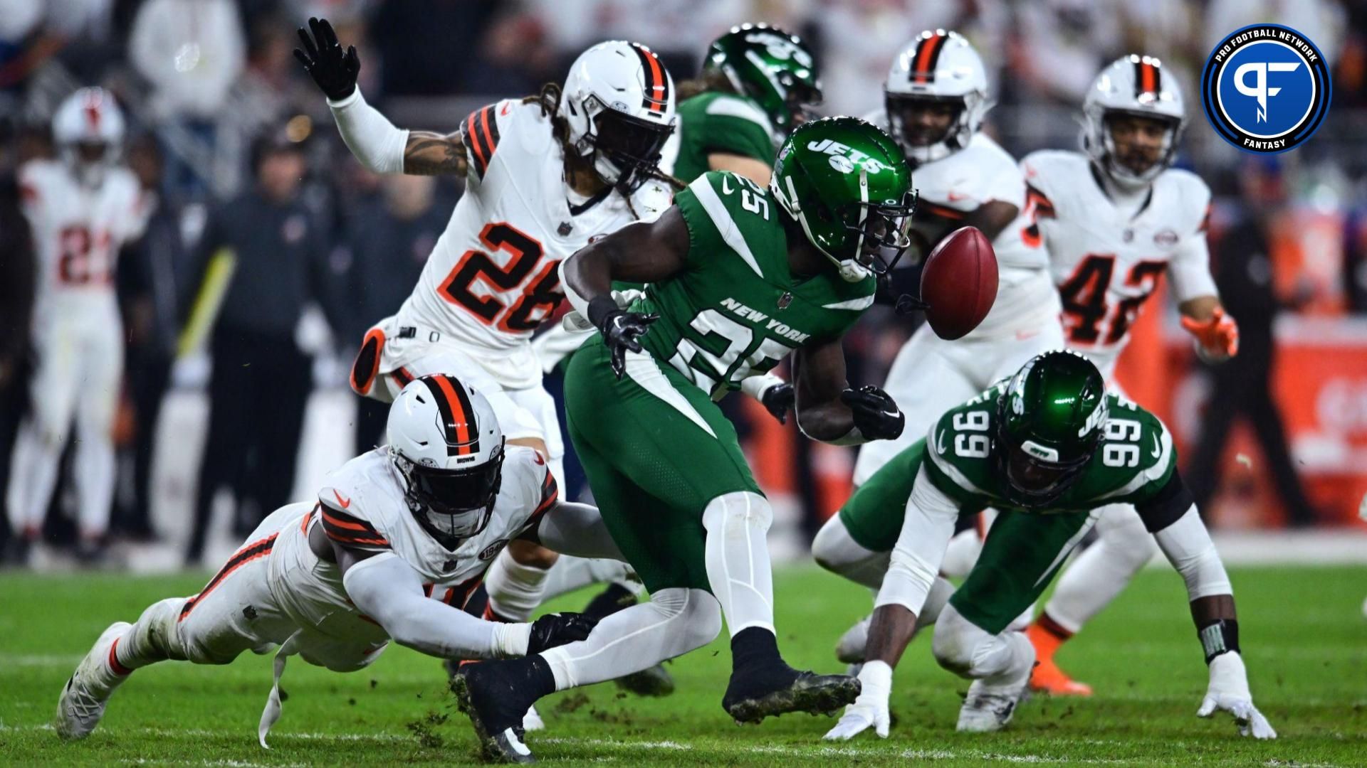 New York Jets running back Israel Abanikanda (25) fumbles a punt return during the first half against the Cleveland Browns at Cleveland Browns Stadium