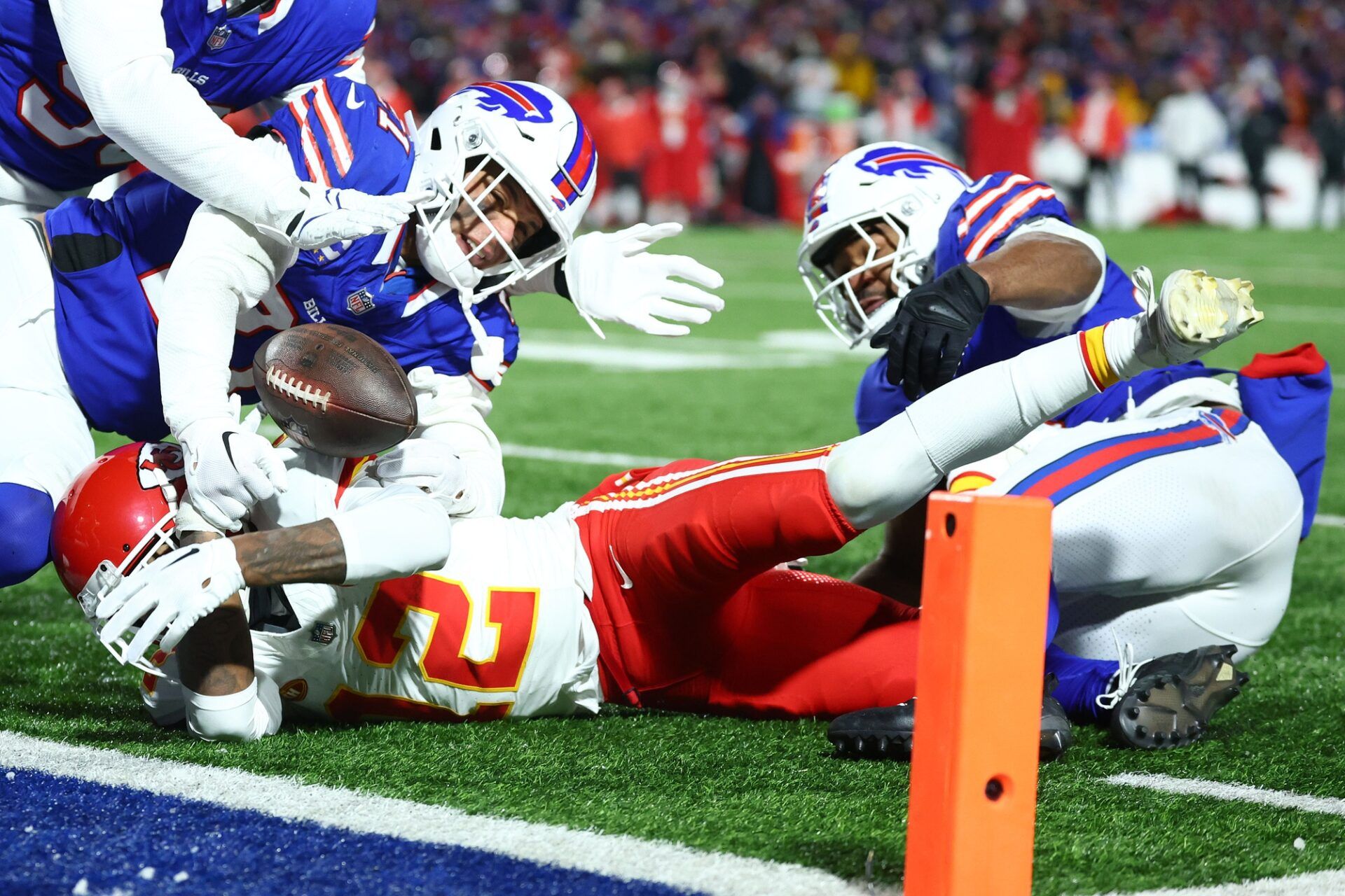 Buffalo Bills safety Jordan Poyer (21) causes a fumble on Kansas City Chiefs wide receiver Mecole Hardman Jr. (12) through the end zone for a touchback during the second half for the 2024 AFC divisional round game at Highmark Stadium.