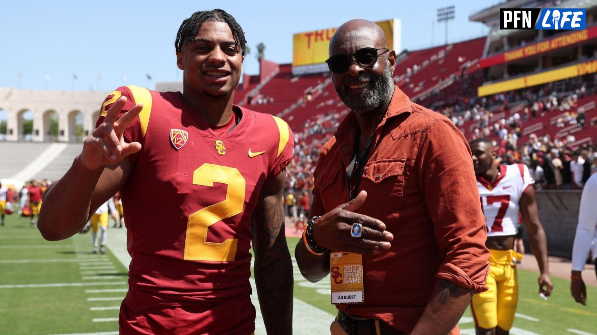 USC Trojans wide receiver Brenden Rice (2) and member of the Pro Football Hall of Fame Jerry Rice pose for a photo after the Spring Game at Los Angeles Memorial Coliseum.