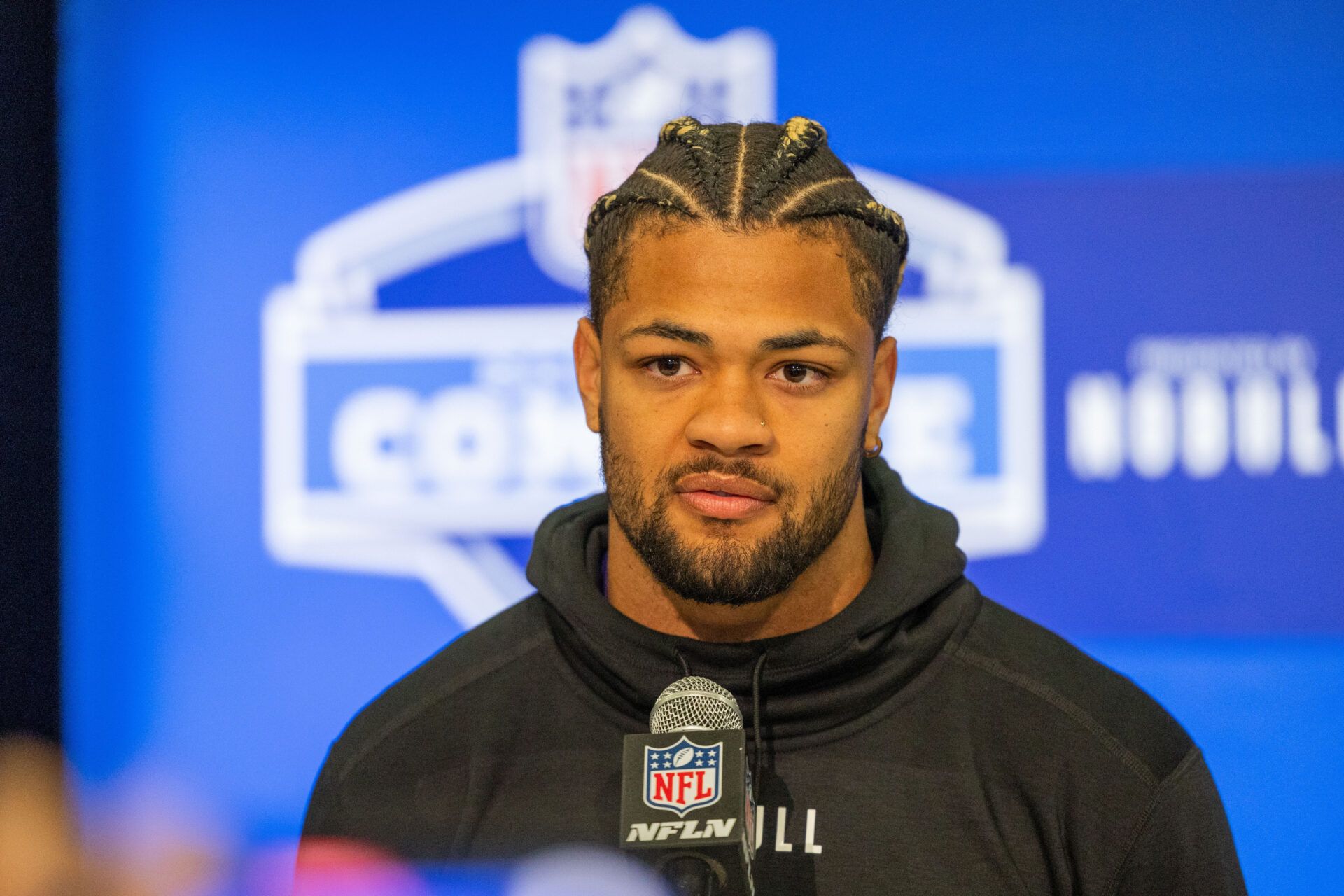 Washington wide receiver Rome Odunze (WO22) talks to the media during the 2024 NFL Combine at Lucas Oil Stadium.