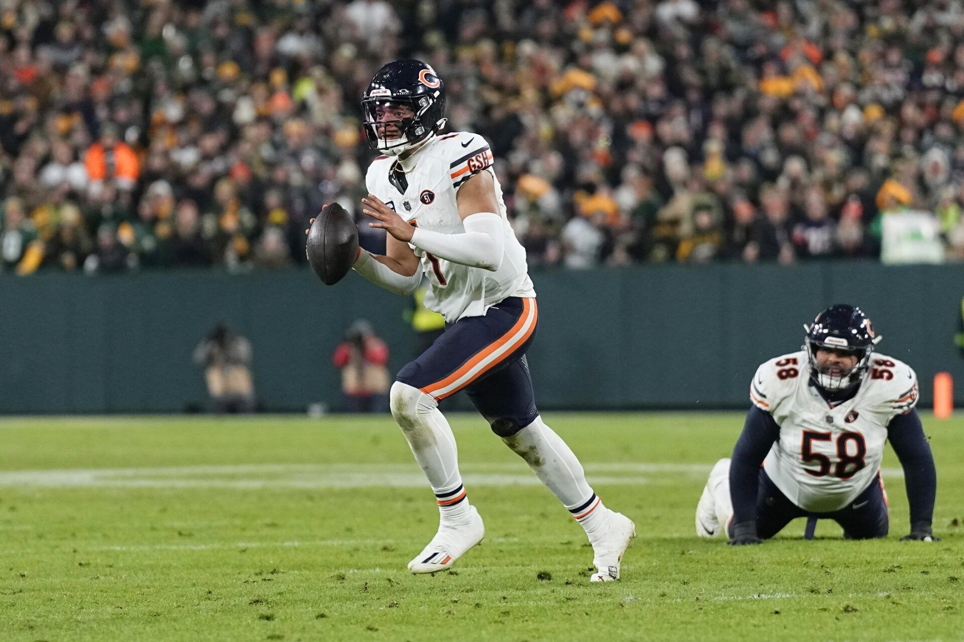 Chicago Bears quarterback Justin Fields (1) looks to throw a pass during the fourth quarter against the Green Bay Packers at Lambeau Field.