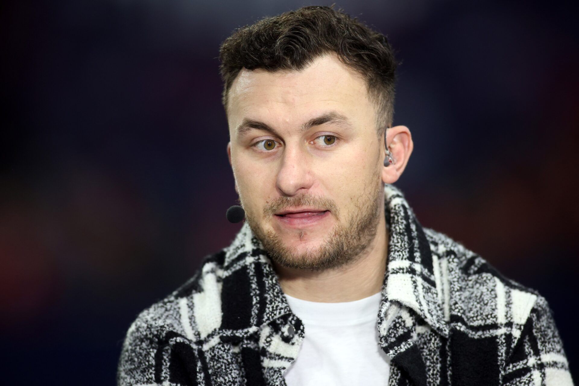 SEC Network announcer Johnny Manziel looks on prior to the SEC Championship game between the Georgia Bulldogs and the LSU Tigers at Mercedes-Benz Stadium.