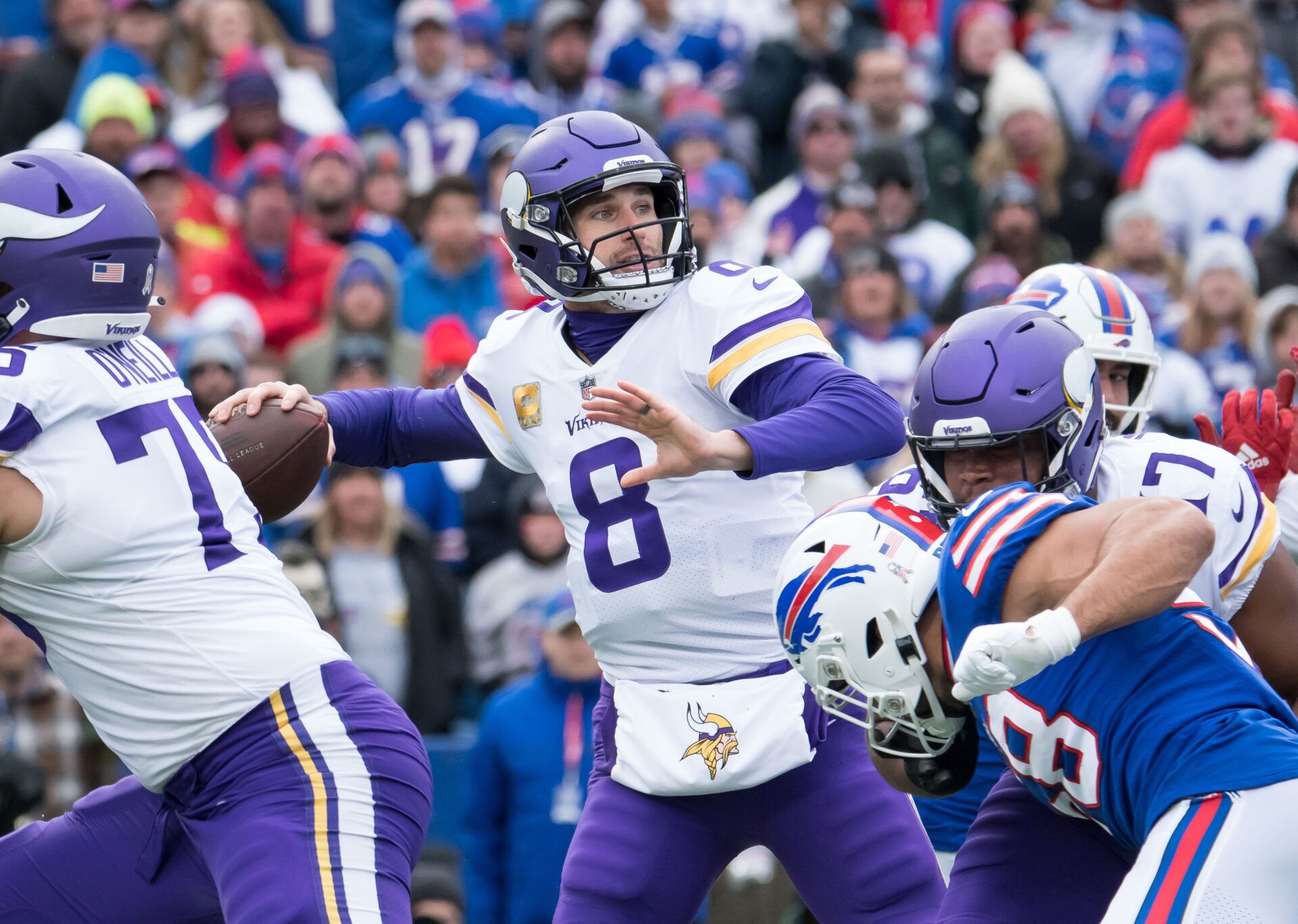 Minnesota Vikings quarterback Kirk Cousins (8) throws a pass in the first quarter at Highmark Stadium.