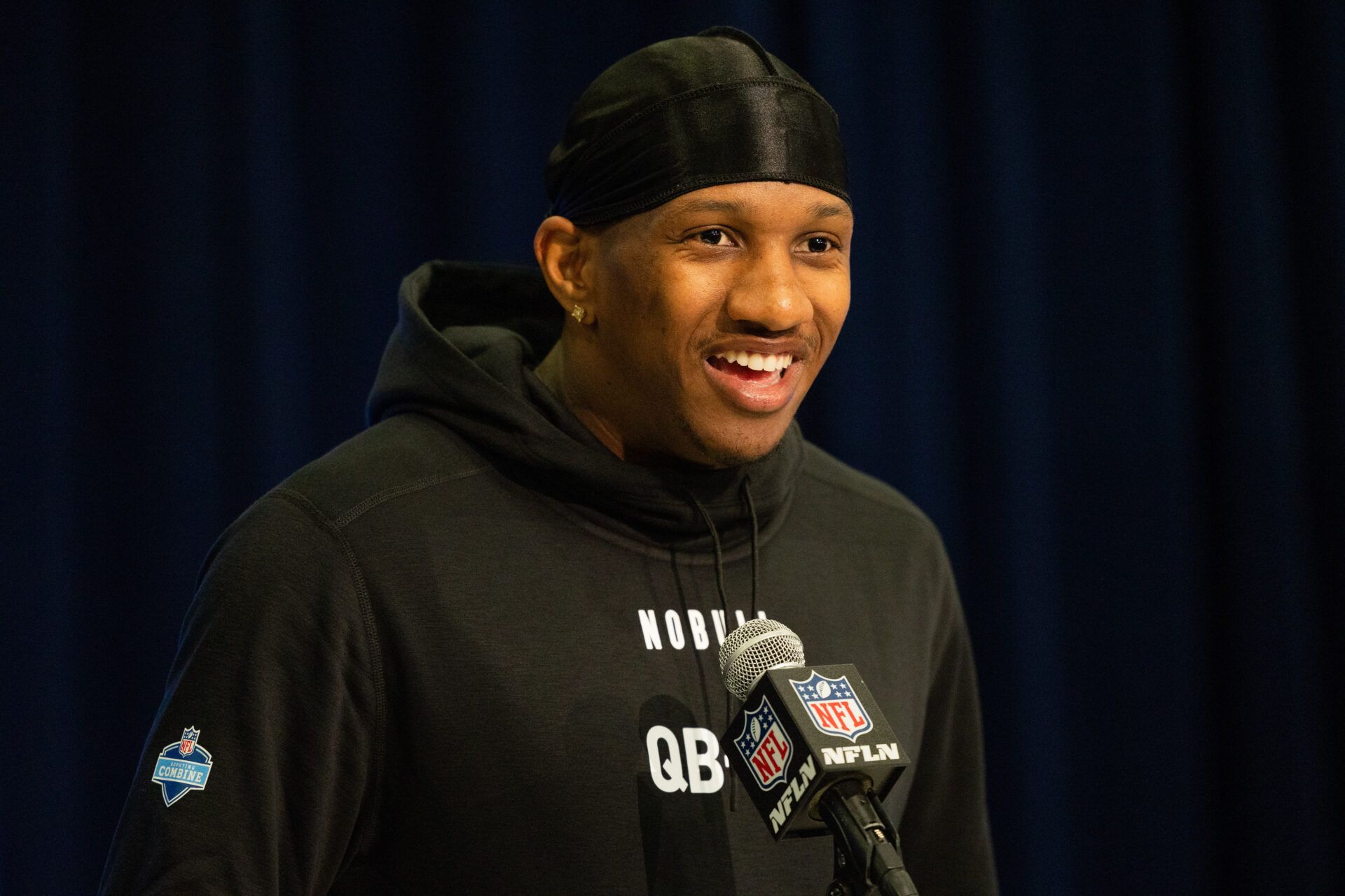 Washington quarterback Michael Penix (QB08) talks to the media during the 2024 NFL Combine at Lucas Oil Stadium.