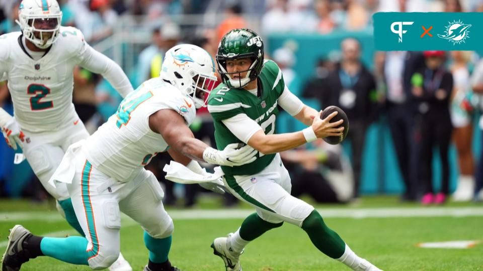 Miami Dolphins defensive tackle Christian Wilkins (94) rushes in on New York Jets quarterback Zach Wilson (2) during the first half at Hard Rock Stadium.