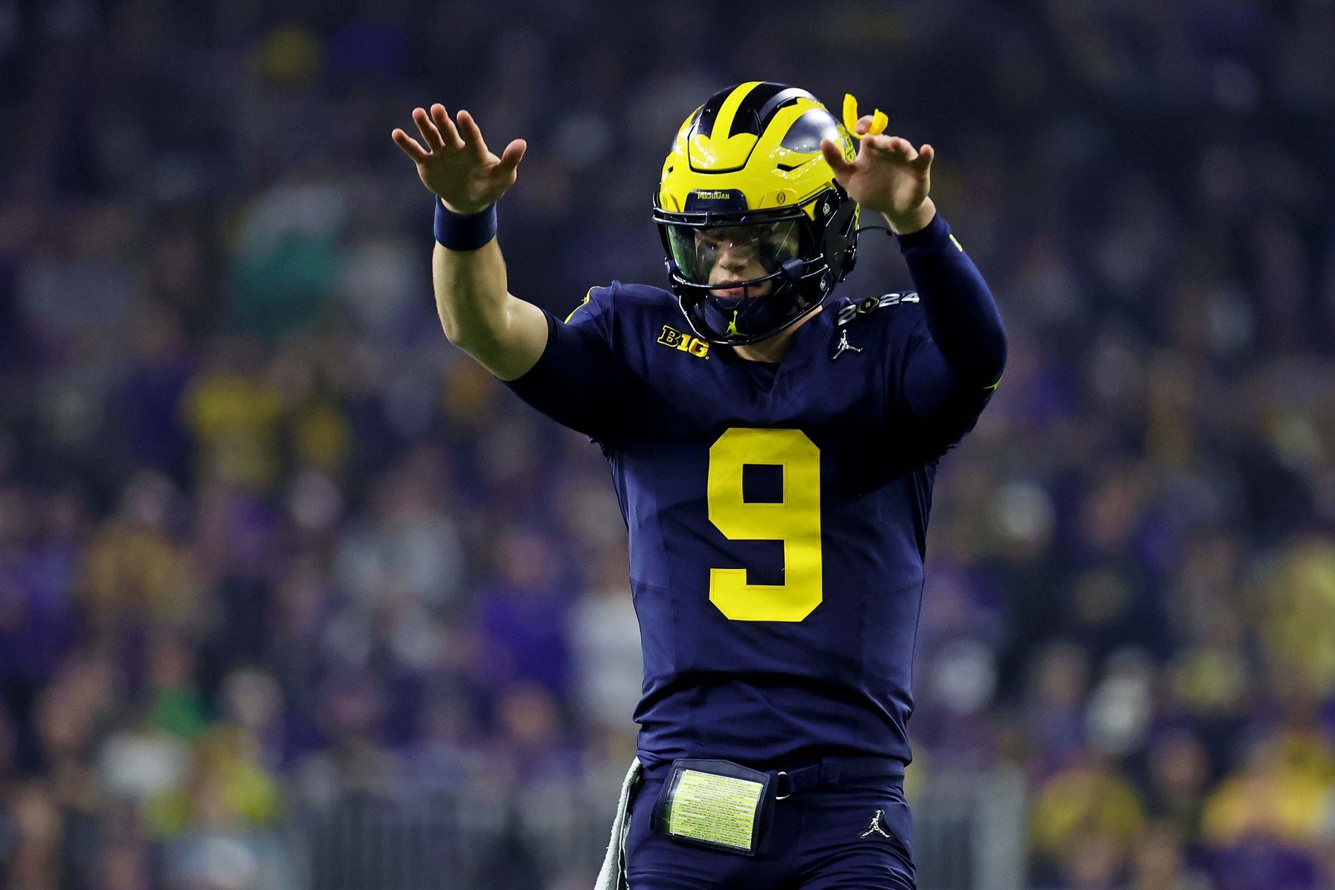 Michigan Wolverines quarterback J.J. McCarthy (9) reacts during the second quarter against the Washington Huskies in the 2024 College Football Playoff national championship game at NRG Stadium.