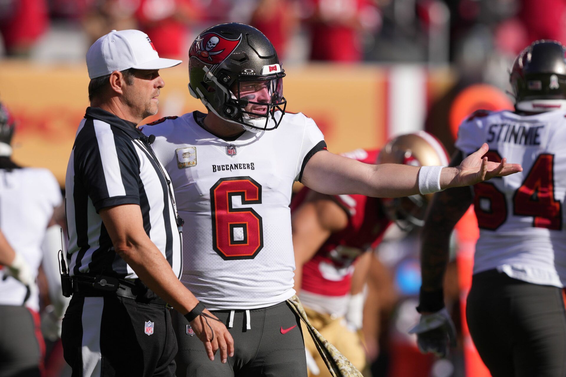 Tampa Bay Buccaneers QB Baker Mayfield (6) talks with a referee during a game.